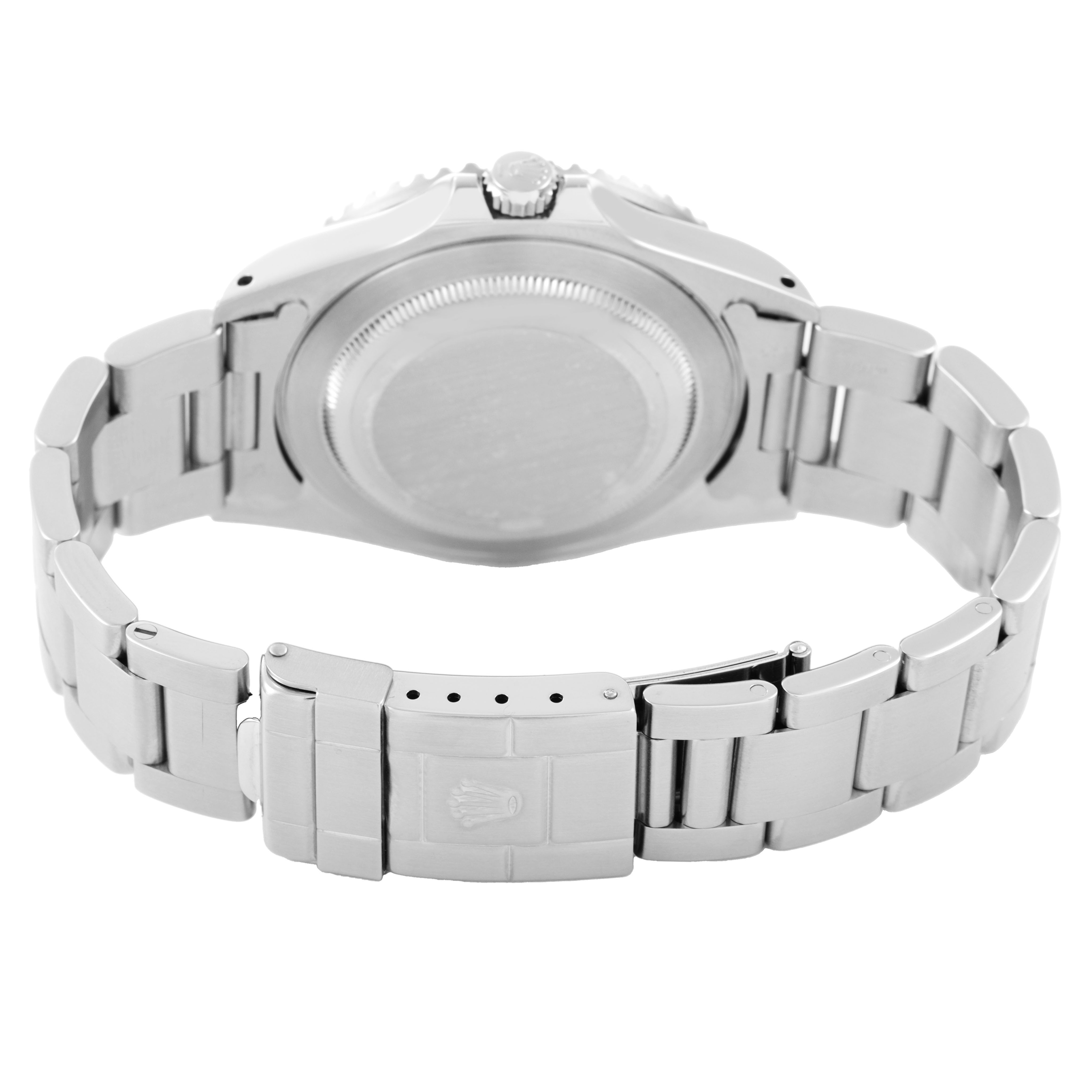 The image shows the back view of a Rolex GMT-Master 16700 Men's Stainless Steel Black Dial watch, highlighting the case back and the metal bracelet with the clasp.