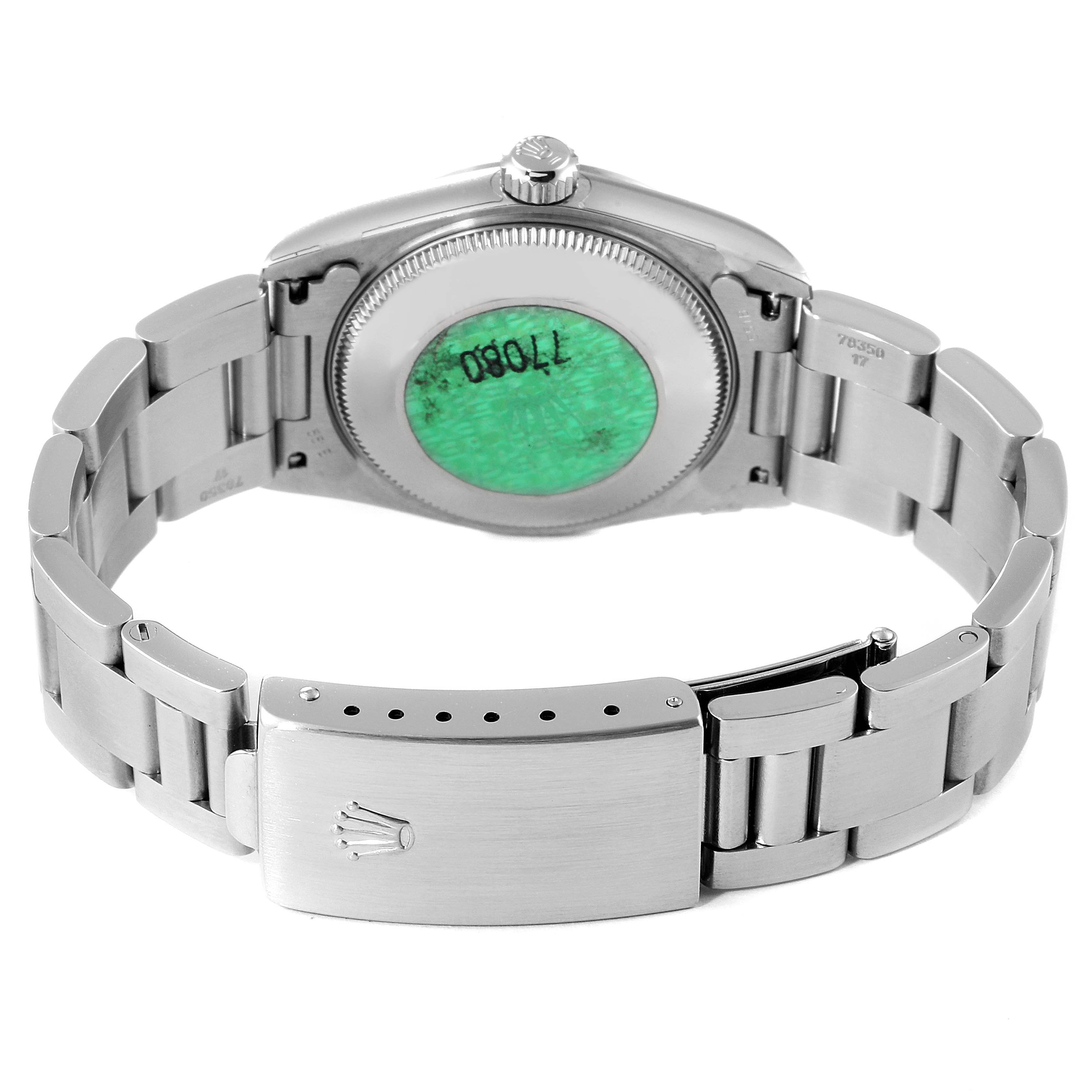 The image shows the back and bracelet of a mid-size Rolex watch, highlighting the case back and clasp.