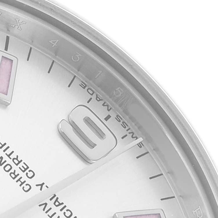 The image shows a close-up of the Rolex Mid-Size 177200 Women
s Stainless Steel Silver Dial dial, focusing on the 9 o
clock numeral and part of the outer bezel.