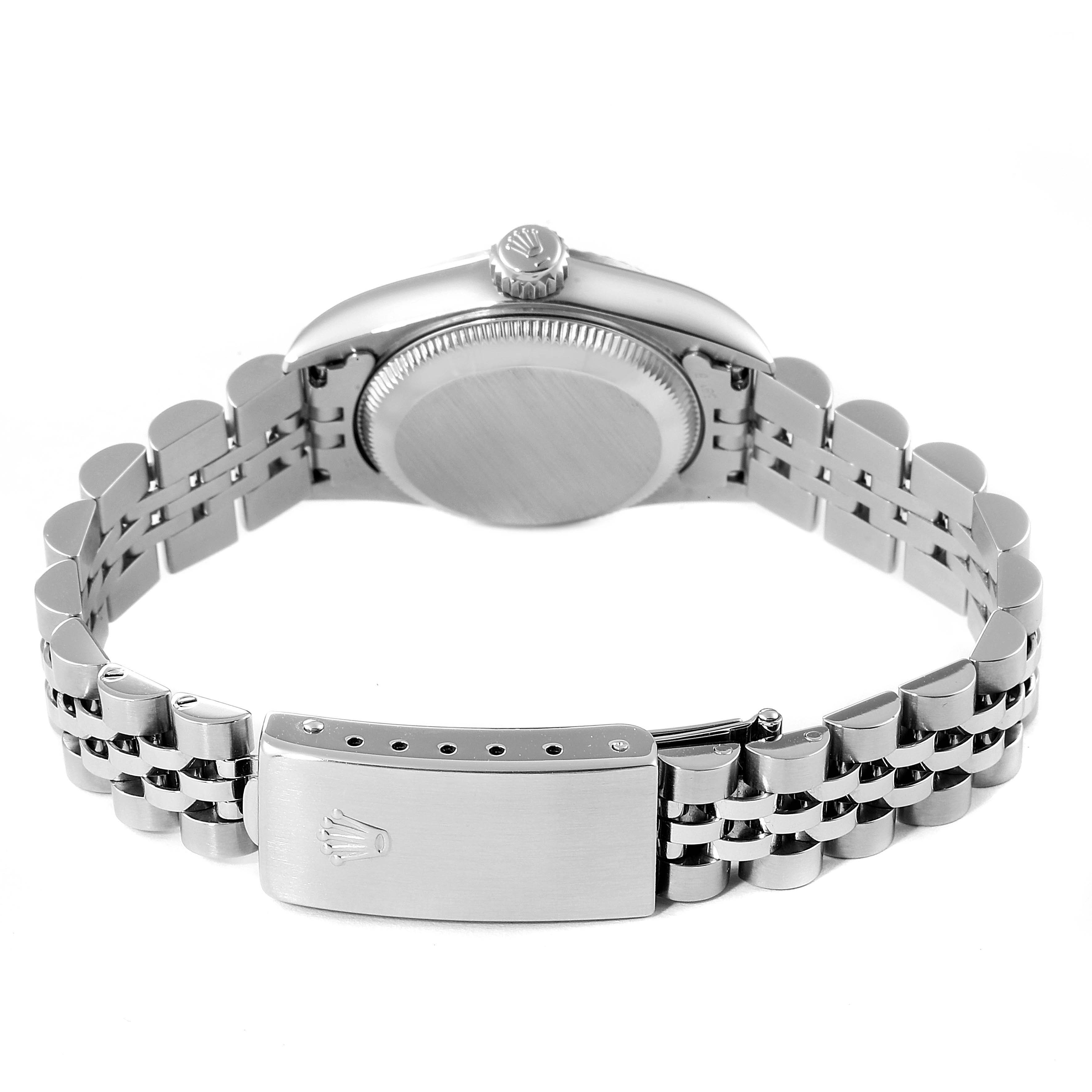 The image shows the back view of a Rolex Oyster Perpetual 67194 Women's Stainless Steel Black Dial 67194 Women's Stainless Steel Black Dial watch, highlighting the case back and metal bracelet with clasp.