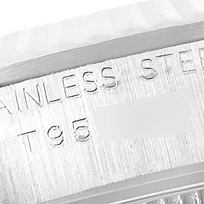 This image shows an angled close-up of the engraved stainless steel case back of a Rolex Oyster Perpetual 67194 Women's Stainless Steel Black Dial 67194 Women's Stainless Steel Black Dial watch.