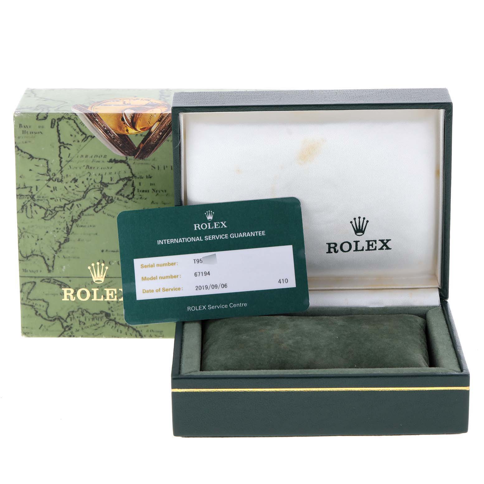 The image shows the packaging and guarantee card for a Rolex Oyster Perpetual 67194 Women's Stainless Steel Black Dial 67194 Women's Stainless Steel Black Dial model, including the box and service card.