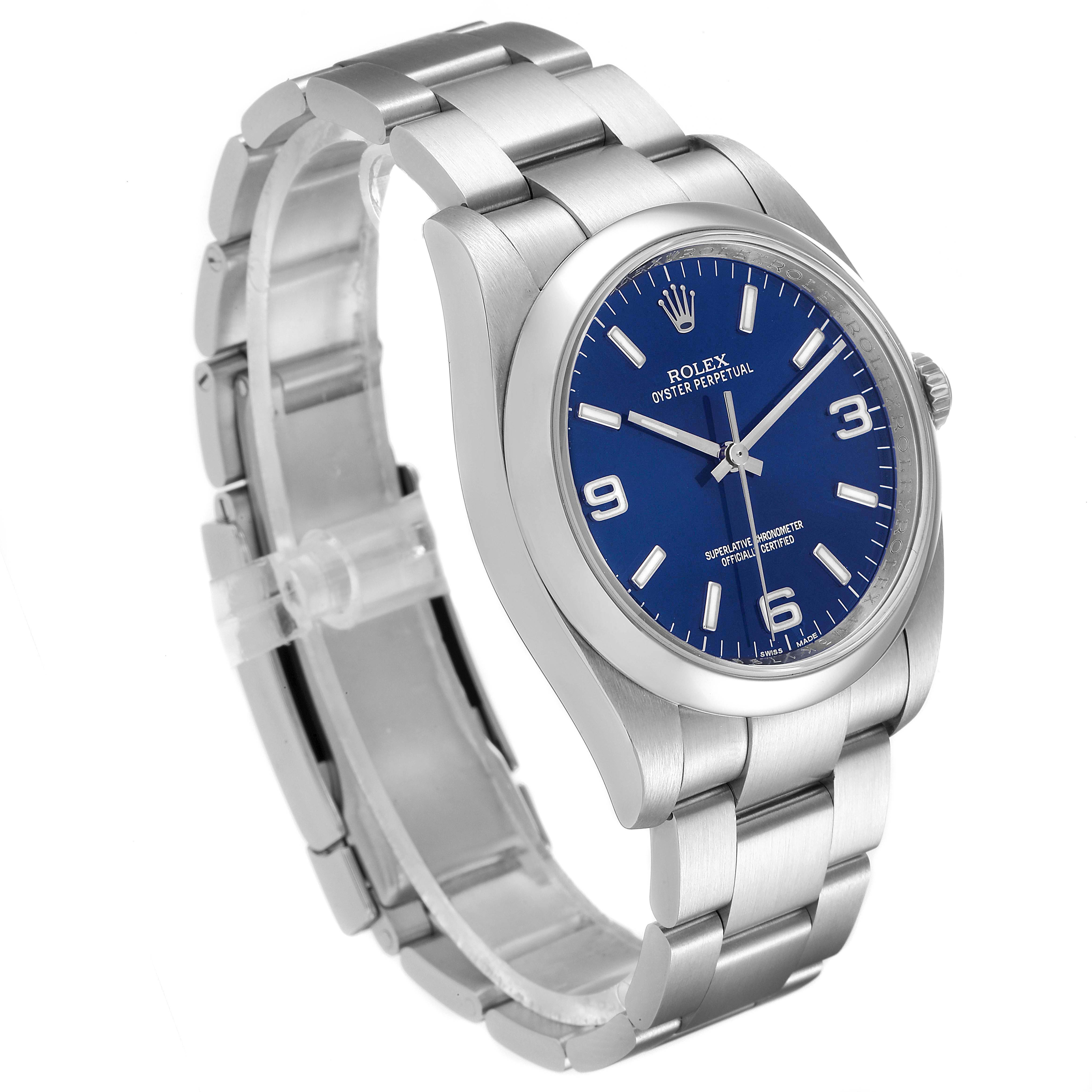 The Rolex Oyster Perpetual 116000 Men's Stainless Steel Blue Dial 116000 Men's Stainless Steel Blue Dial watch is shown at a slight side angle, highlighting its blue dial, stainless steel case, and bracelet.