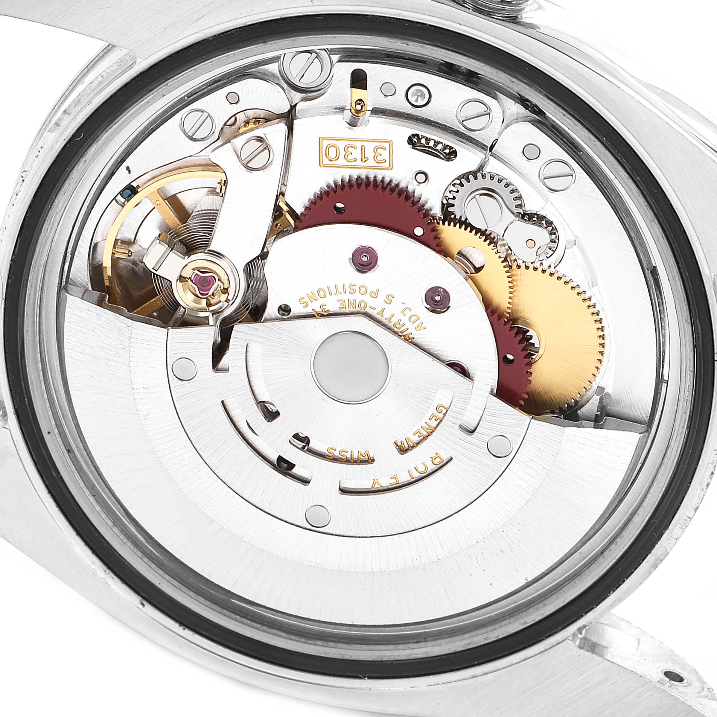 The image shows the internal movement mechanism of a Rolex Oyster Perpetual 116000 Men's Stainless Steel Blue Dial 116000 Men's Stainless Steel Blue Dial watch from a back angle.