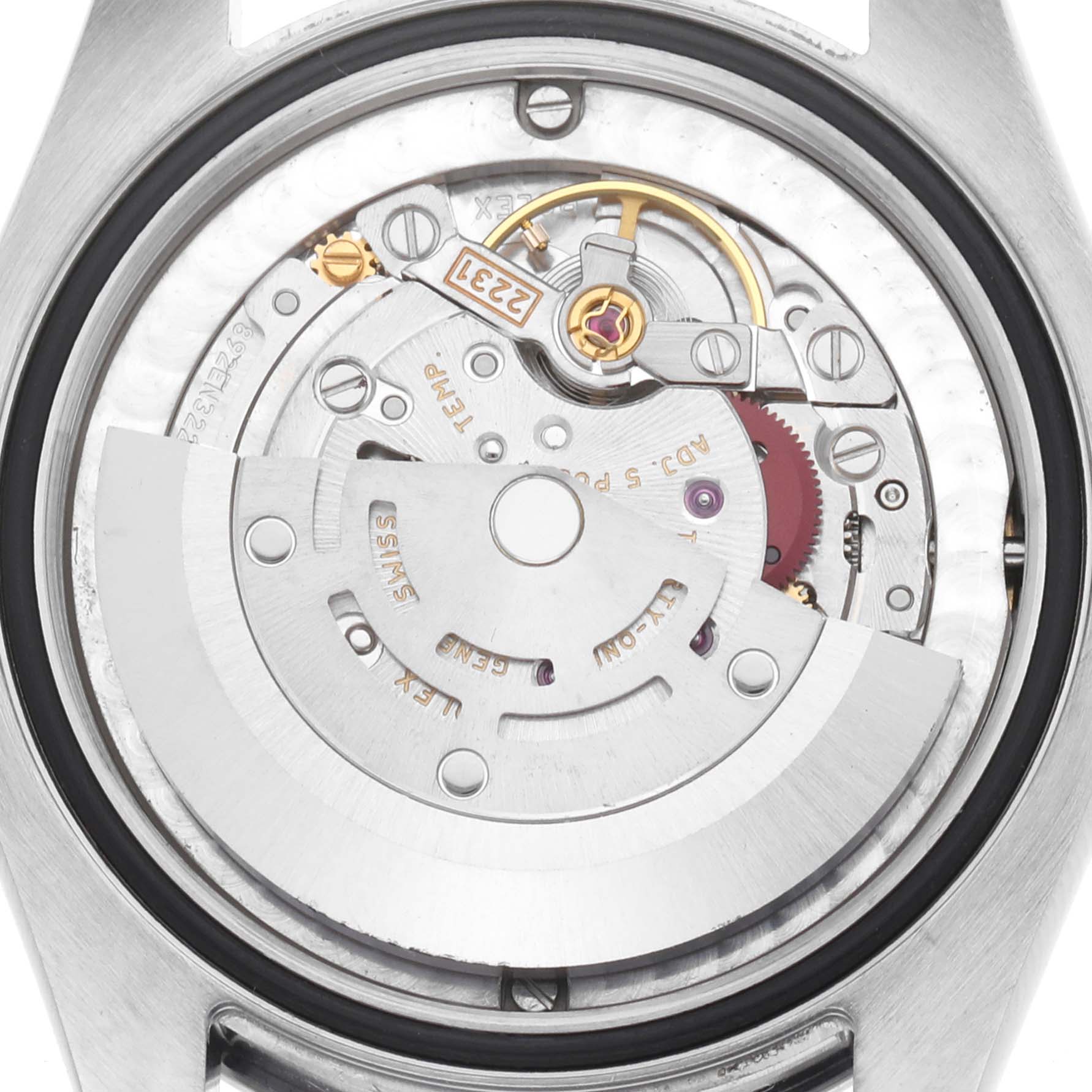 The image shows the back of a Rolex Mid-Size 177200 Women
s Stainless Steel Grey Dial watch, highlighting its mechanical movement components.