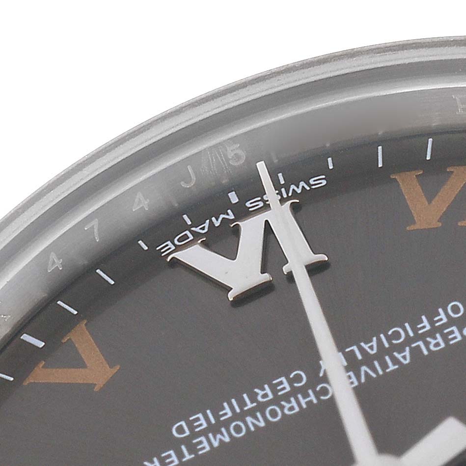 The image shows a close-up of the dial on a Rolex Mid-Size 177200 Women
s Stainless Steel Grey Dial watch, highlighting the hour markers and hands.