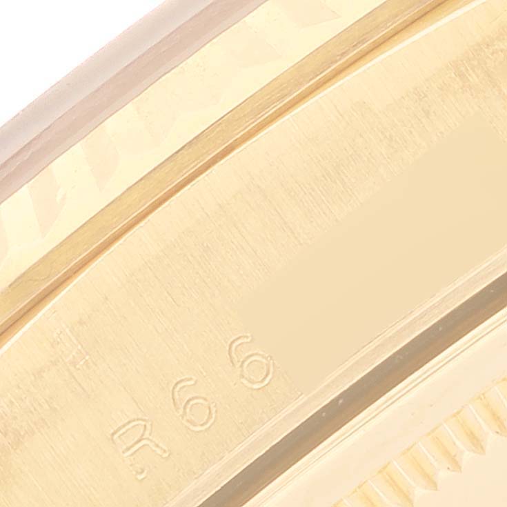 This close-up shows the inner bezel and part of the outer edge of the Rolex President 18238 Men
s Yellow Gold Champagne Dial 18238 Men
s Yellow Gold Champagne Dial model watch, showcasing its fine markings.