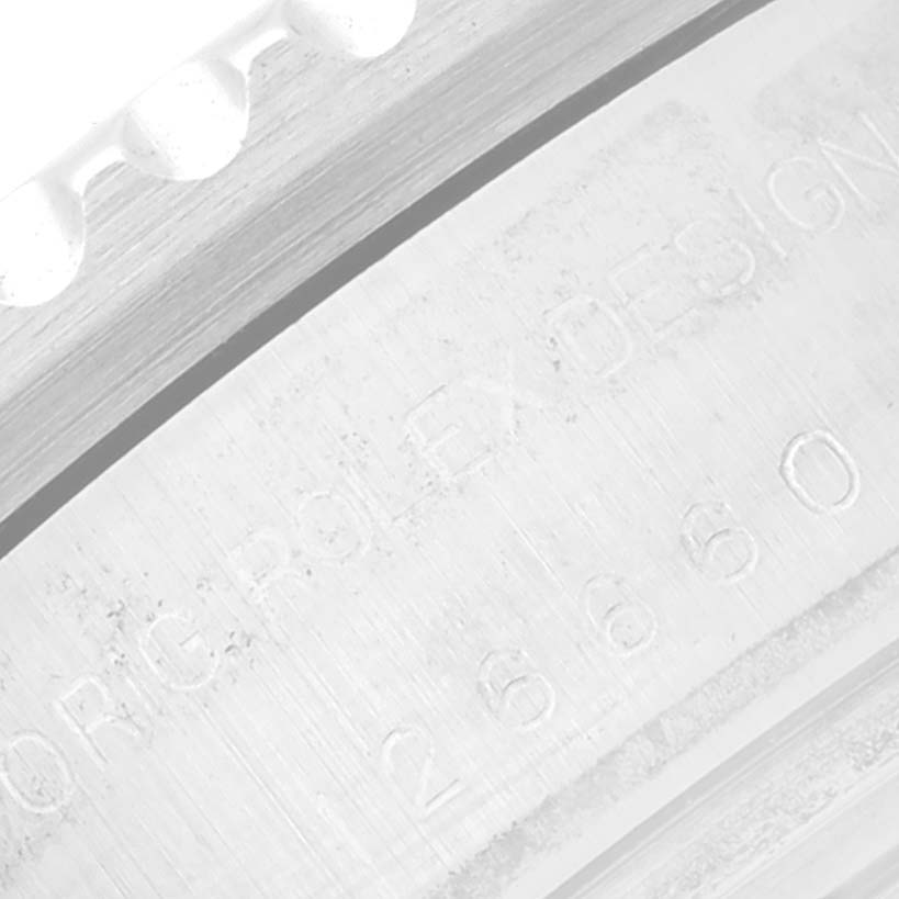 The image shows a close-up of the outer rim and engraved inner ring of a Rolex Sea-Dweller 126660 Men's Stainless Steel Blue Dial 126660 Men's Stainless Steel Blue Dial watch.