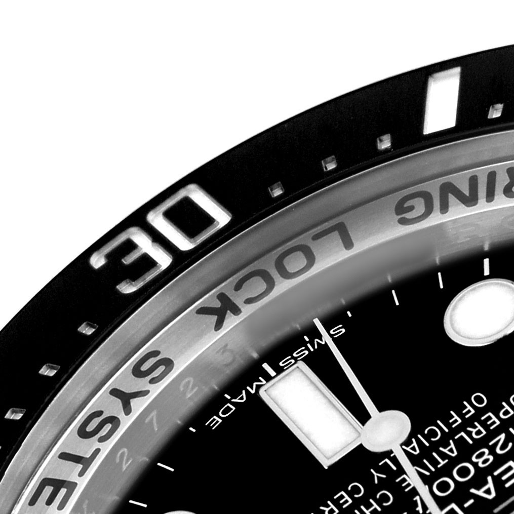 The image shows a close-up of the bezel and part of the dial of a Rolex Sea-Dweller 116660 Men's Stainless Steel Blue Dial, highlighting the "Ring Lock System" and markers.