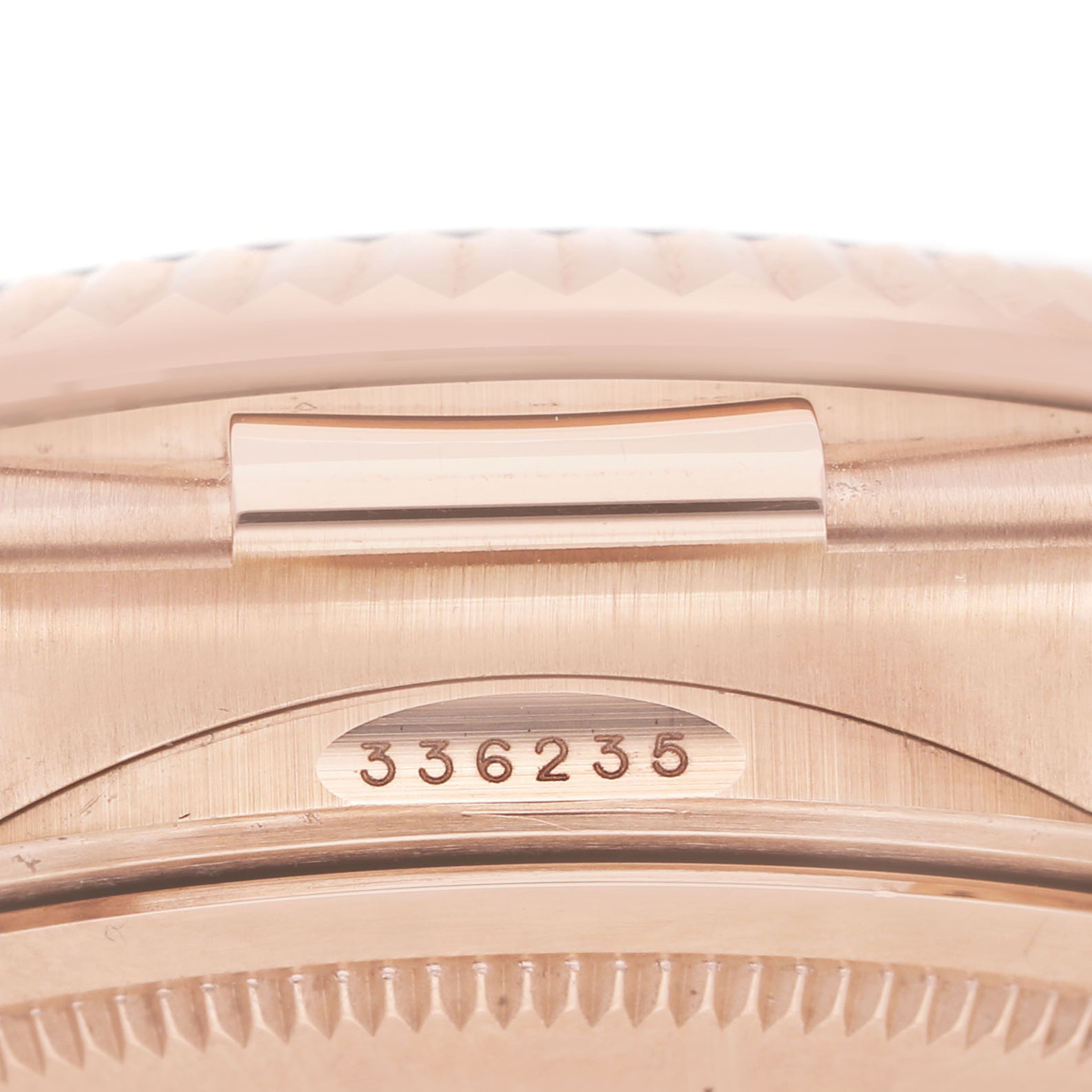 The image shows a close-up of the Rolex Sky-Dweller 336235 Men's Rose Gold Brown Dial, highlighting the case side and serial number.