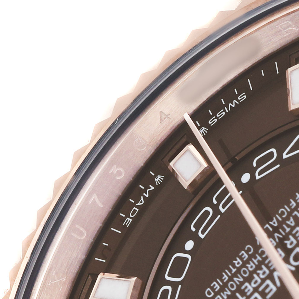 This image shows a close-up of the dial and bezel, focusing on the numerals and part of the hand of the Rolex Sky-Dweller 336235 Men's Rose Gold Brown Dial.