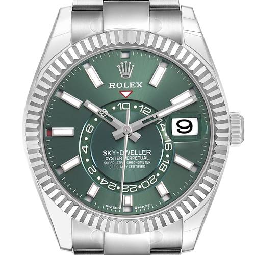 The Rolex Sky-Dweller 336934 Men's Stainless Steel Green Dial watch is shown from a front angle, highlighting the green dial, hands, date window, and fluted bezel.