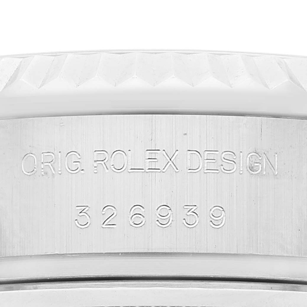 This image shows a close-up of the model and serial number engraved on the side of the case of a Rolex Sky-Dweller 326939 Men's White Gold White Dial 326939 Men's White Gold White Dial watch.