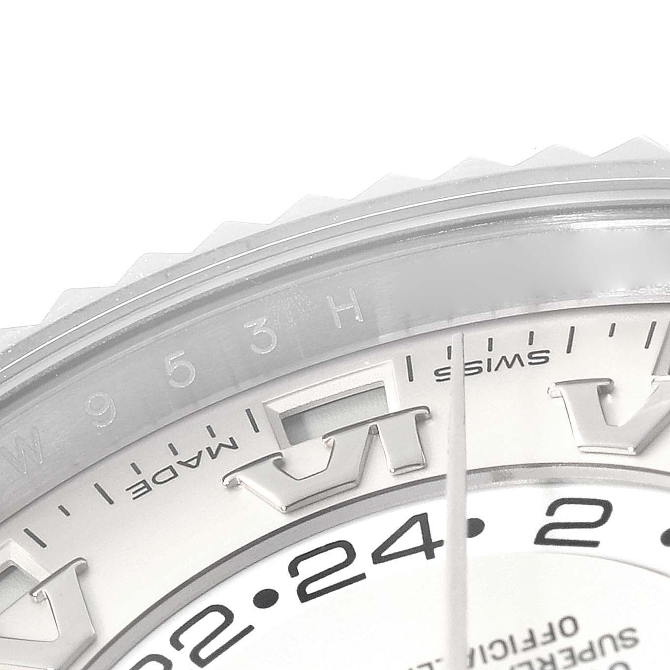 This close-up image shows the upper section of the dial and bezel of a Rolex Sky-Dweller 326939 Men's White Gold White Dial 326939 Men's White Gold White Dial watch.