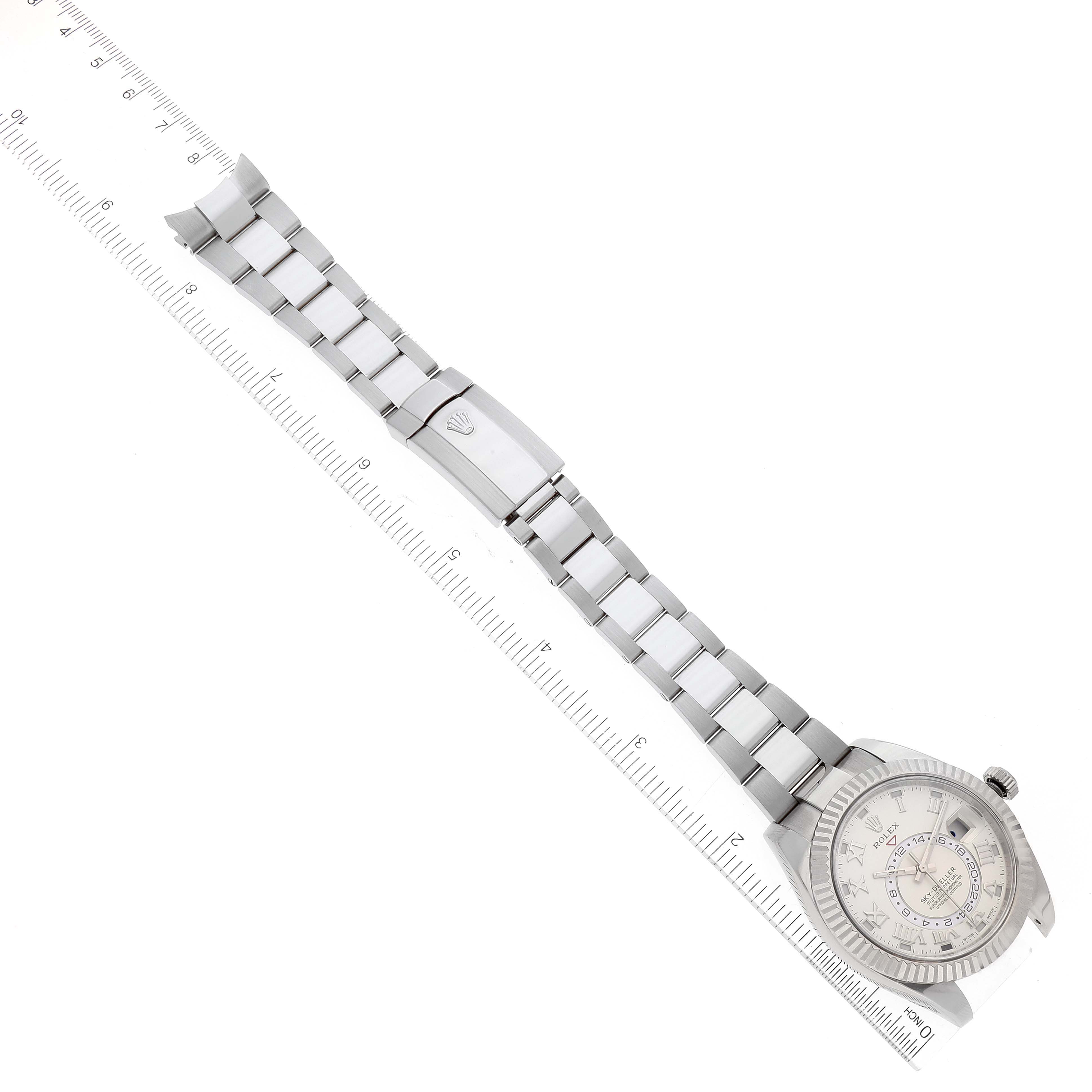 The Rolex Sky-Dweller 326939 Men's White Gold White Dial 326939 Men's White Gold White Dial watch is shown at an overhead angle, featuring the face, bracelet, and clasp.