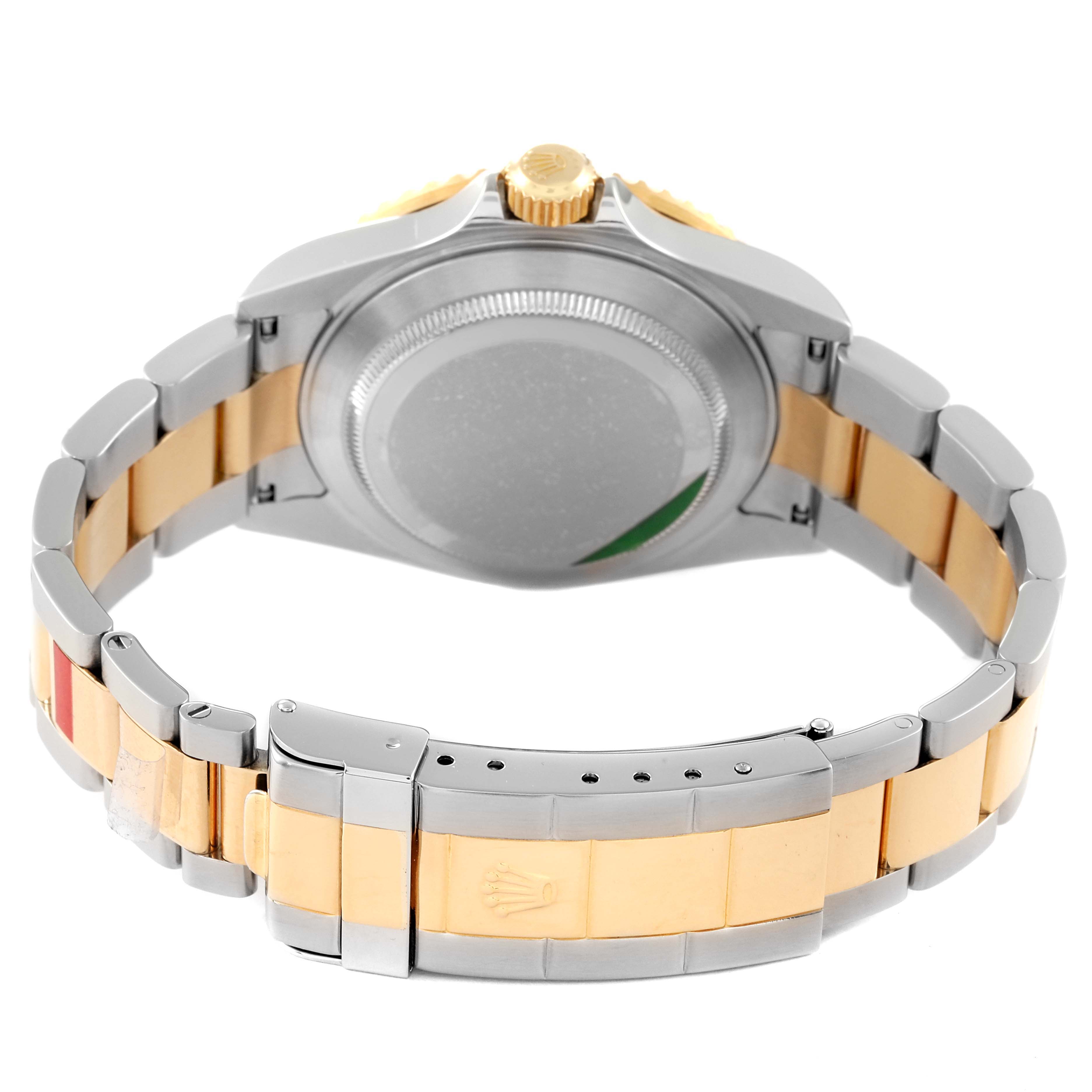 The image shows the back case and bracelet of a Rolex Submariner 16613 Men
s Steel and Gold (two tone) Blue Dial 16613 Men
s Steel and Gold (two tone) Blue Dial, viewed from the rear with a two-tone metal band.