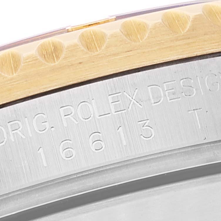 The image shows a close-up of the Submariner model by Rolex, highlighting the bezel edge and engraved serial number.