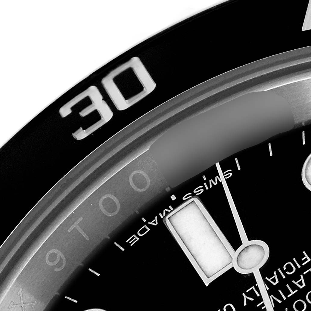 The image shows a close-up of the bezel and part of the dial of a Rolex Submariner 116610 Men's Stainless Steel Black Dial 116610 Men's Stainless Steel Black Dial watch.