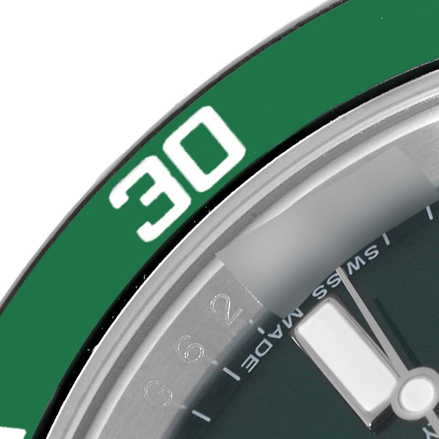 This close-up image shows the bezel and part of the dial of a Rolex Submariner 116610LV Men
s Stainless Steel Green Dial 116610LV Men
s Stainless Steel Green Dial watch, specifically around the 30-minute mark.