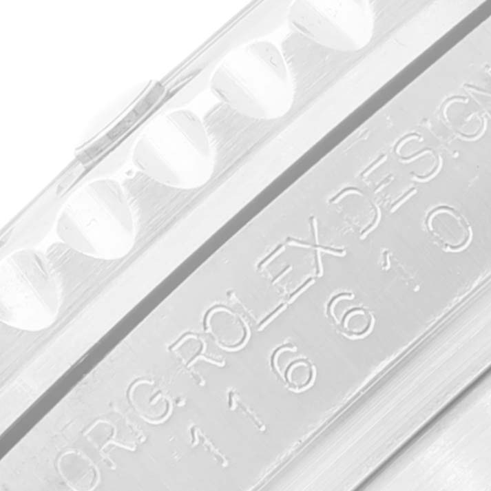This image shows an extreme close-up of the bezel and engraved text of a Rolex Submariner 116610LV Men
s Stainless Steel Green Dial 116610LV Men
s Stainless Steel Green Dial watch.