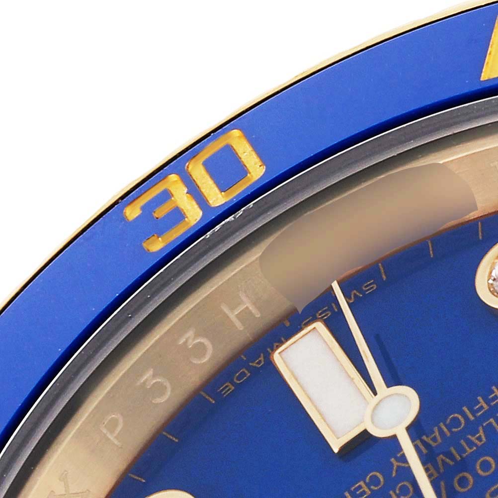 The image shows a close-up angle of the dial and bezel of a Rolex Submariner 116618 Men's Yellow Gold Blue Dial 116618 Men's Yellow Gold Blue Dial watch, highlighting the 30-minute marker in gold on the blue bezel.