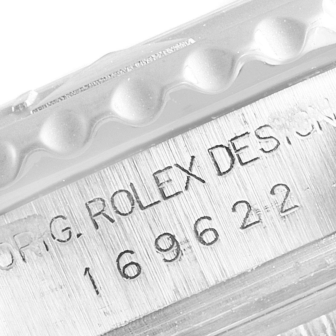 This close-up image shows part of the bezel and engraved serial number on a Rolex Yacht-Master 169622 Women's Stainless Steel Silver Dial 169622 Women's Stainless Steel Silver Dial watch.