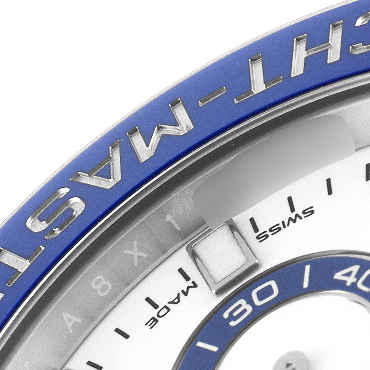 The image shows a close-up of the bezel and part of the dial of a Rolex Yacht-Master 116680 Men's Stainless Steel White Dial 116680 Men's Stainless Steel White Dial watch.