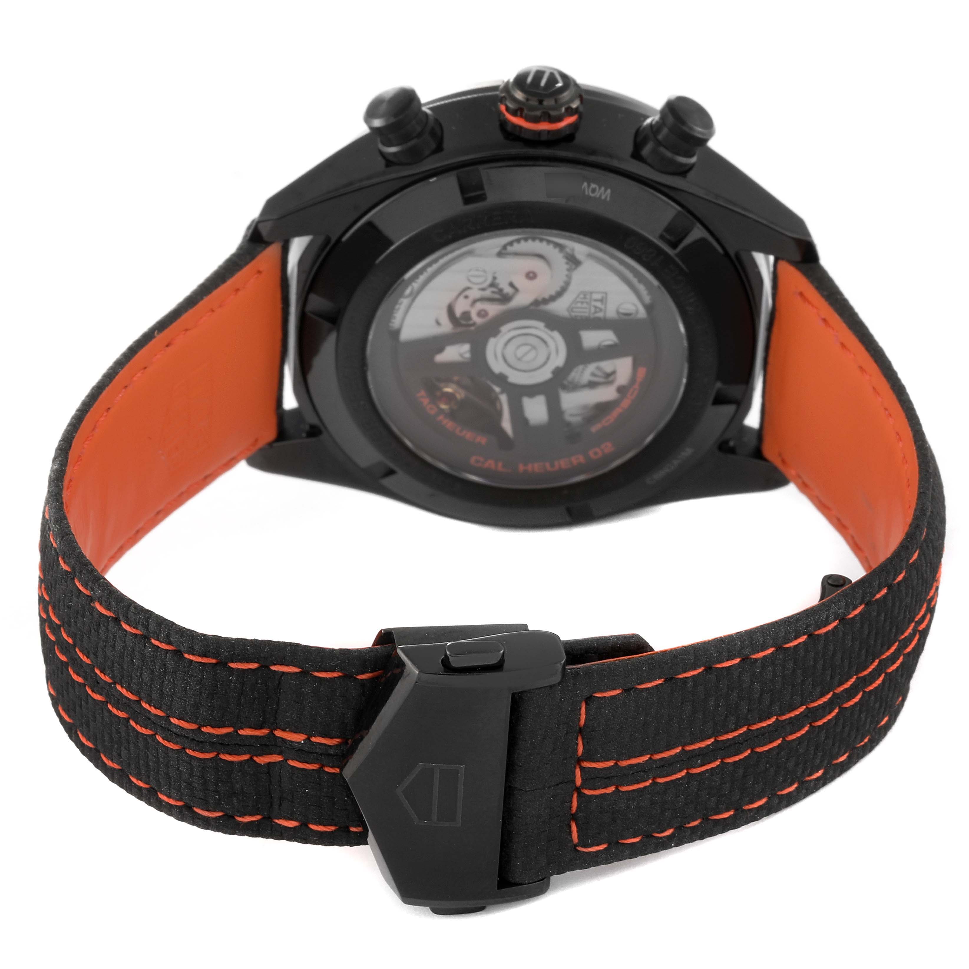 The image shows the back view of the Tag Heuer Limited Edition CBN2A1M.FC6526 Men's Stainless Steel Black Dial CBN2A1M.FC6526 Men's Stainless Steel Black Dial watch including the straps, clasp, and movement through the transparent case back.