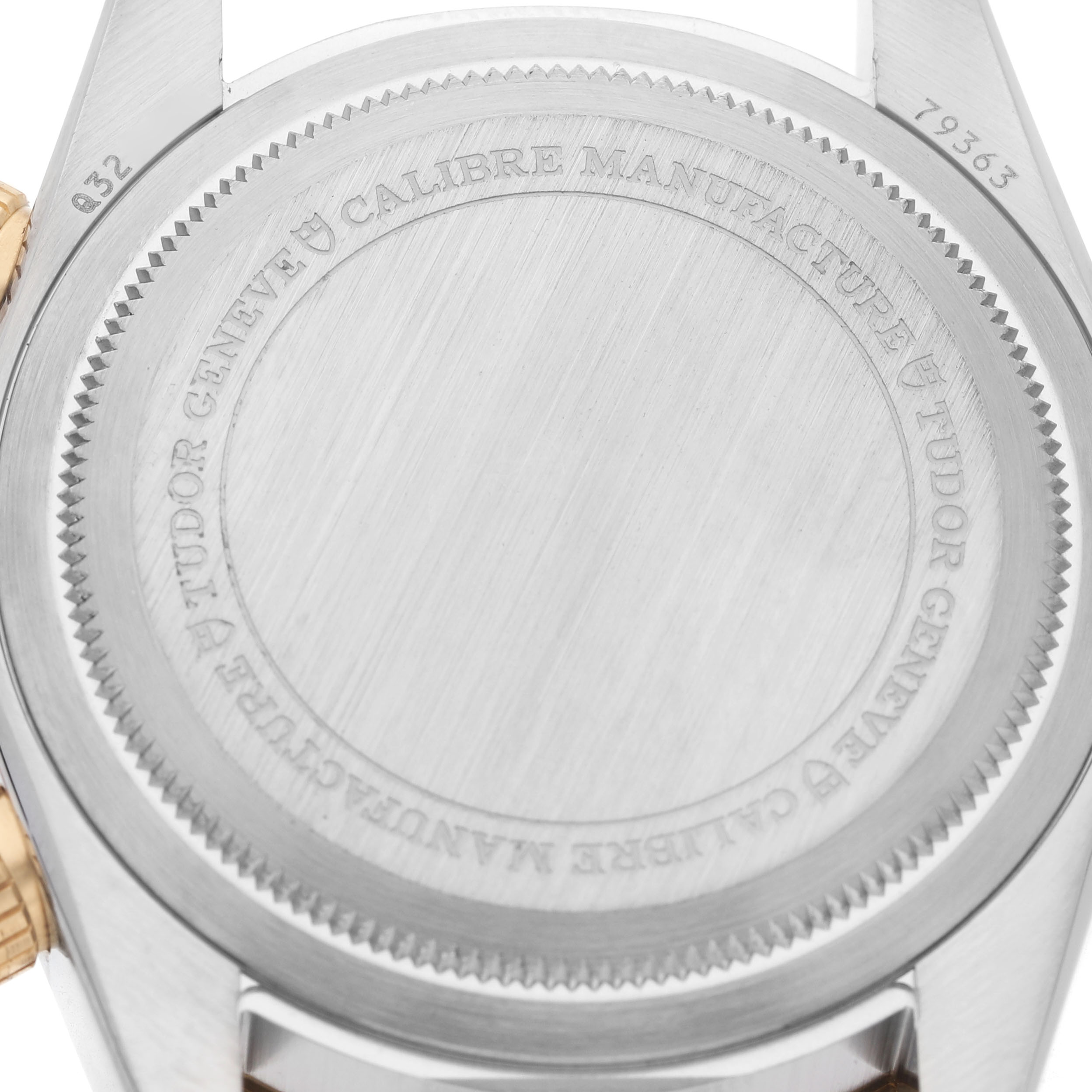 The image shows the back of the Heritage Black Bay by Tudor, highlighting the engraved case back and lugs.