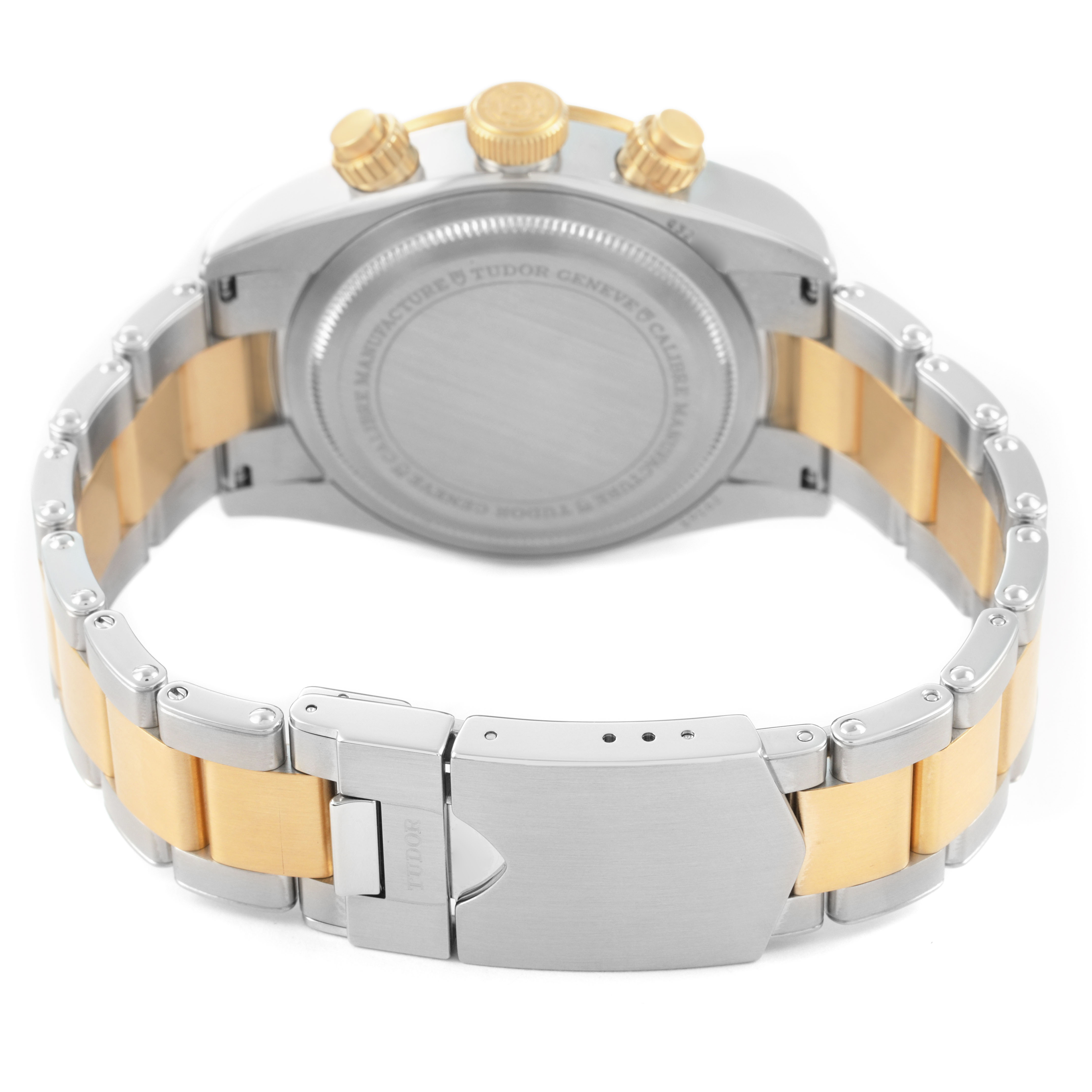 The image shows the back and bracelet of a Tudor Heritage Black Bay 79363N Men's Steel and Gold (two tone) Black Dial watch, focusing on the clasp and case back.