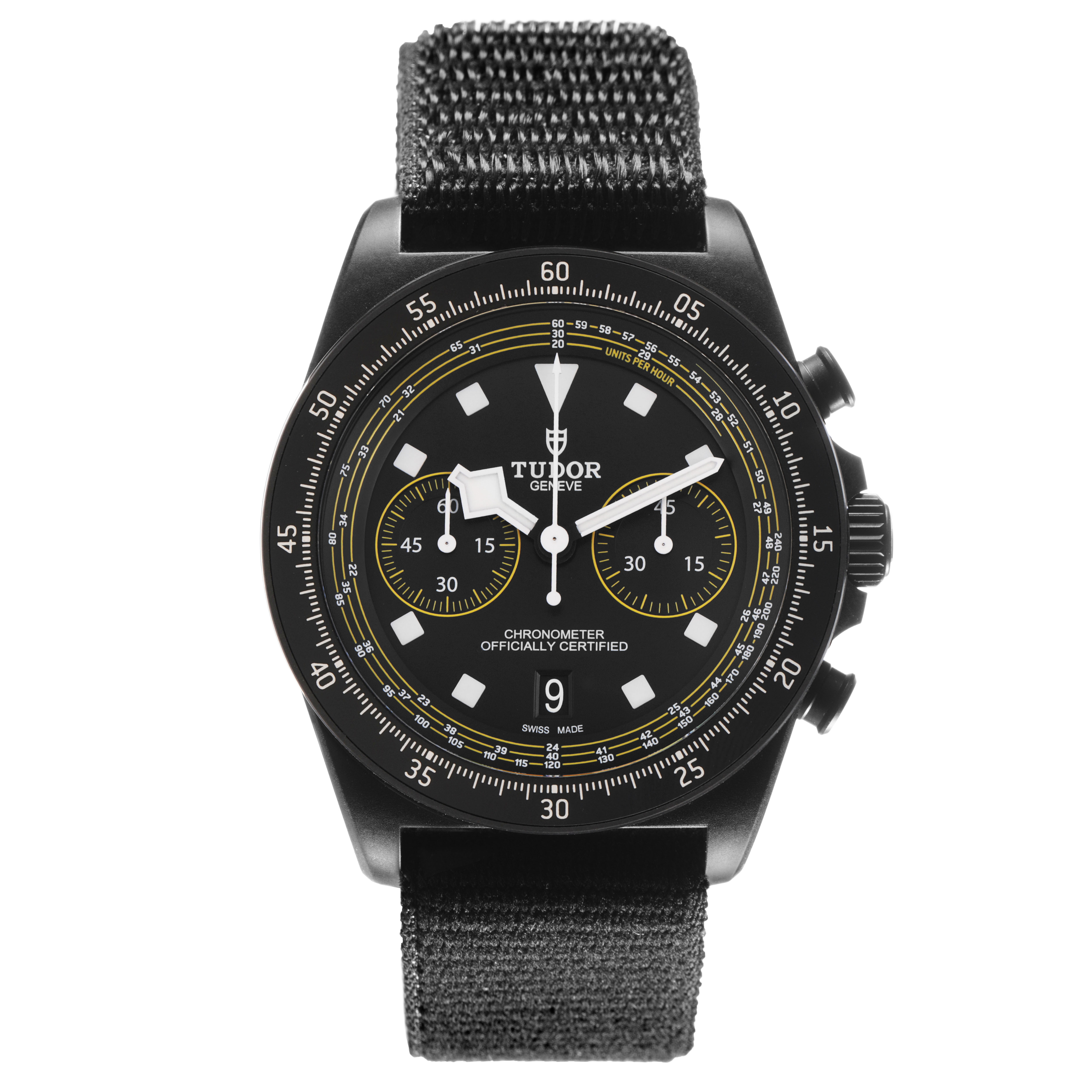 The Tudor watch shown is a top view of a Pelagos model, displaying its face and fabric strap.