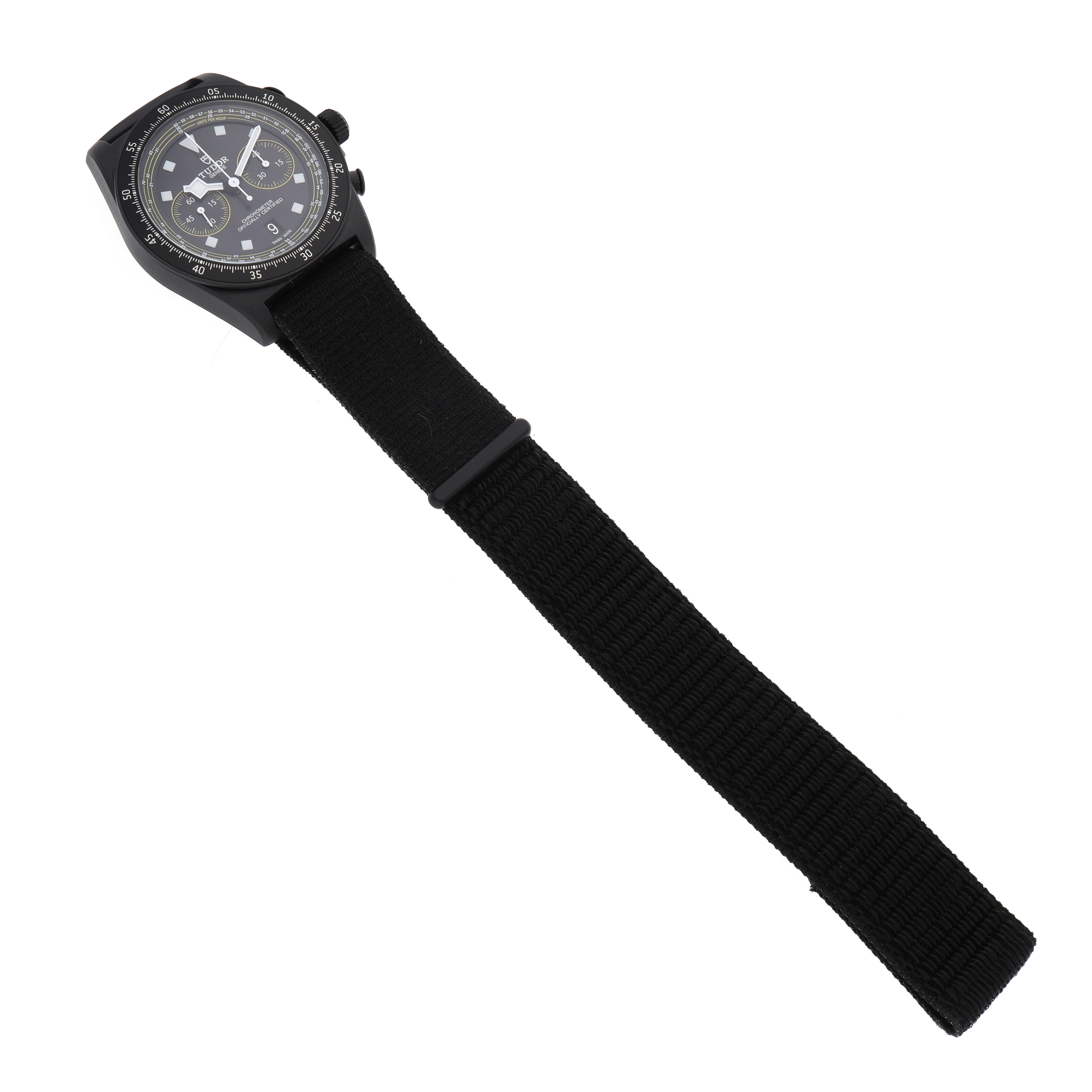 This image shows a Tudor Pelagos 25827KNJN Men's Titanium Black Dial watch at a slight angle, highlighting the dial and bezel, along with a black fabric strap.