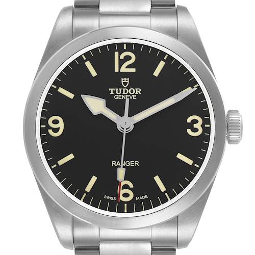 The Tudor Heritage Ranger 79950-0001 Men's Stainless Steel Black Dial watch is shown from a frontal angle, displaying the dial, hands, bezel, and part of the bracelet.