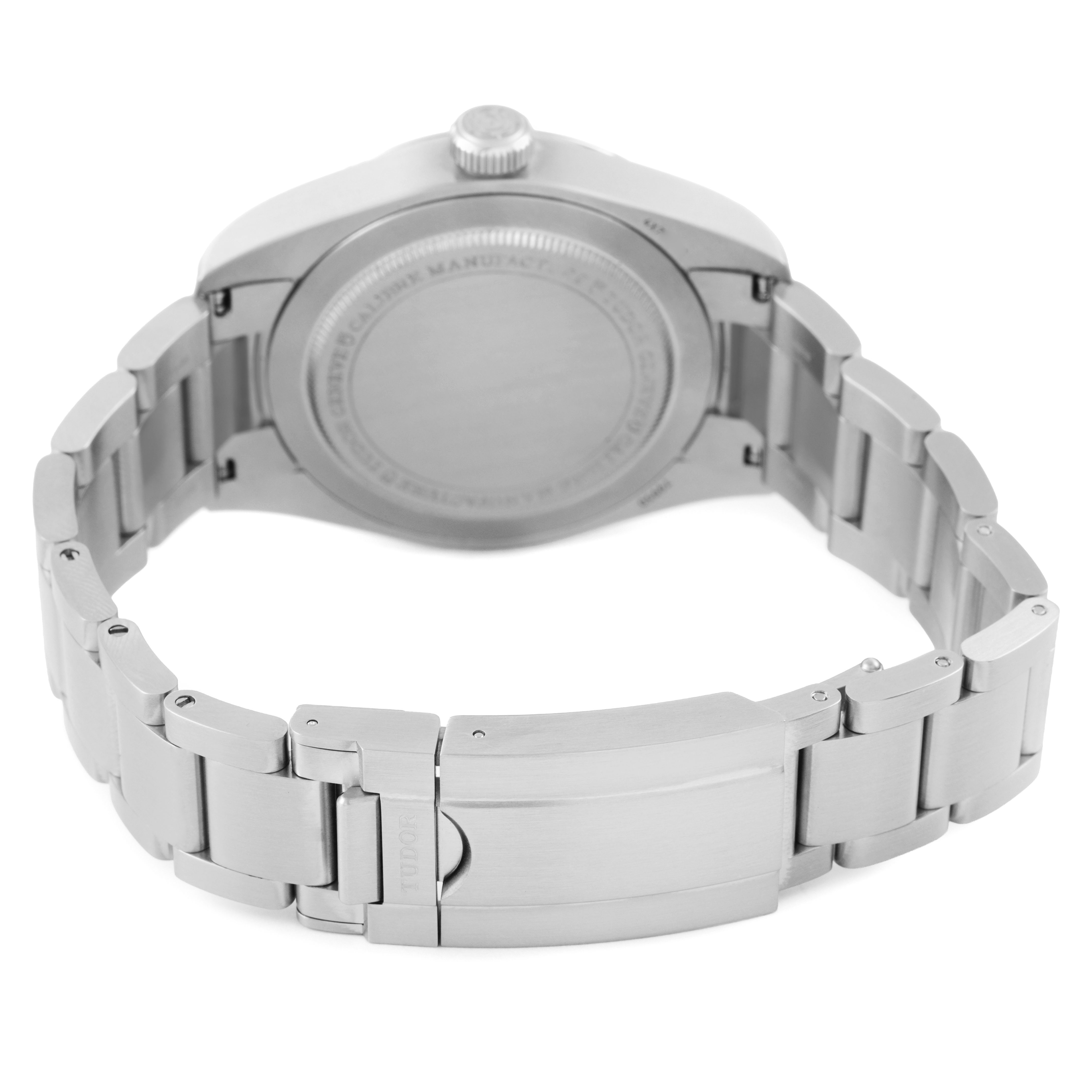 The Tudor Heritage Ranger 79950-0001 Men's Stainless Steel Black Dial watch is shown from the back, highlighting its case back, bracelet, and clasp.