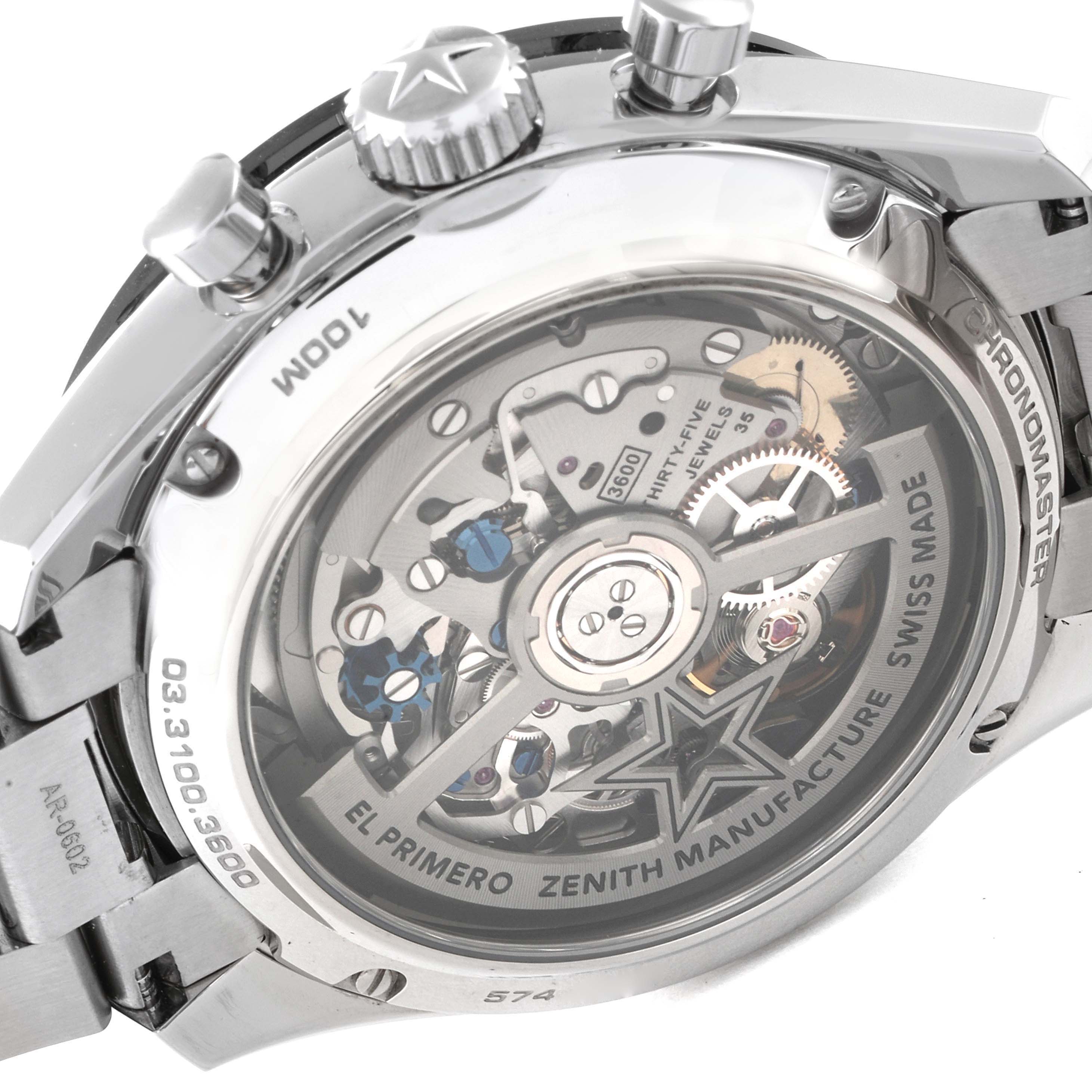 The image shows the back view of a Zenith Chronomaster 03.3100.3600/21.M3100 Men's Stainless Steel Black Dial 03.3100.3600/21.M3100 Men's Stainless Steel Black Dial watch, highlighting its intricate El Primero movement and inner workings.