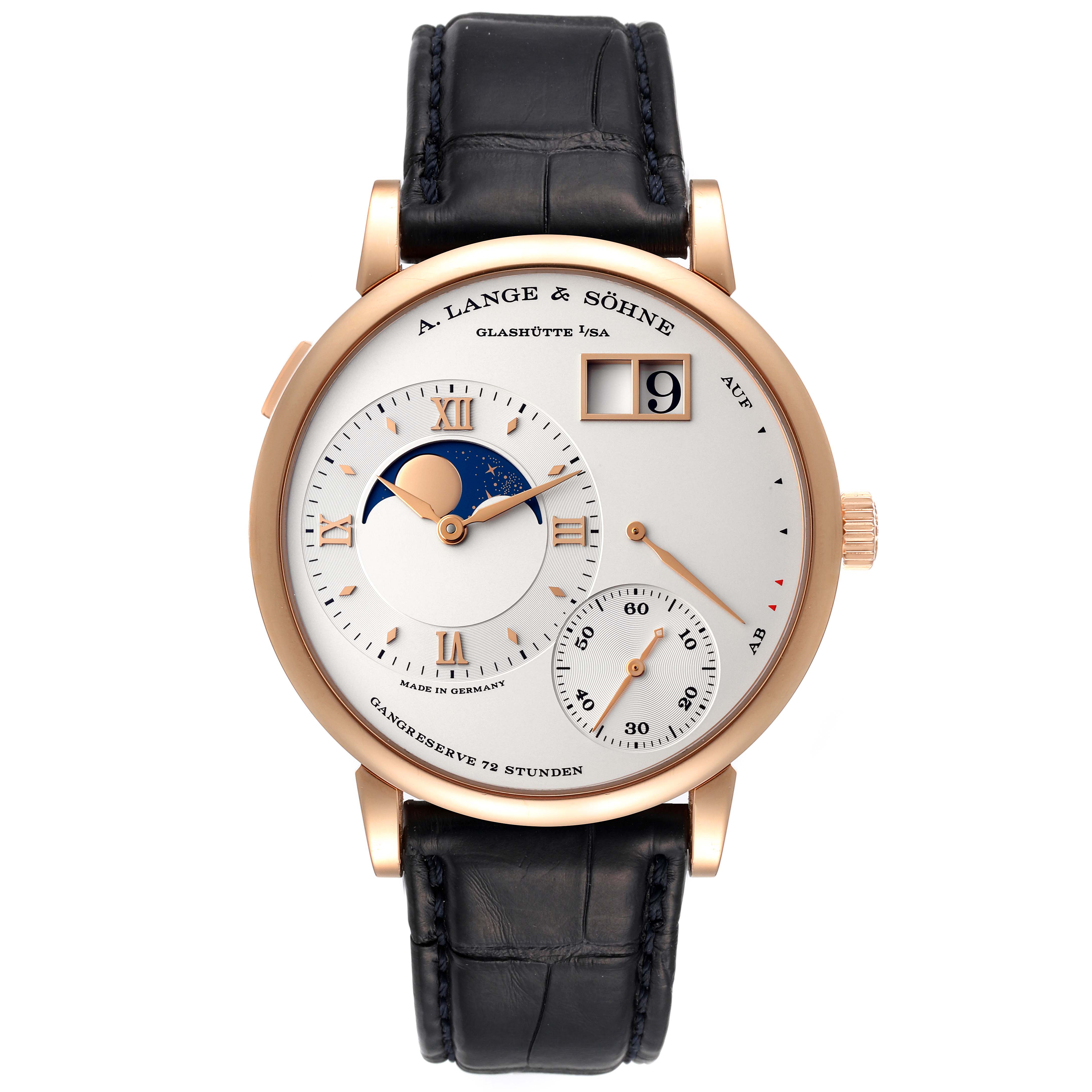 The image shows a A. Lange & Sohne Lange 1 139.032 Men's Rose Gold Silver Dial watch from a front angle, highlighting its dial, moon phase, date display, and black leather strap.