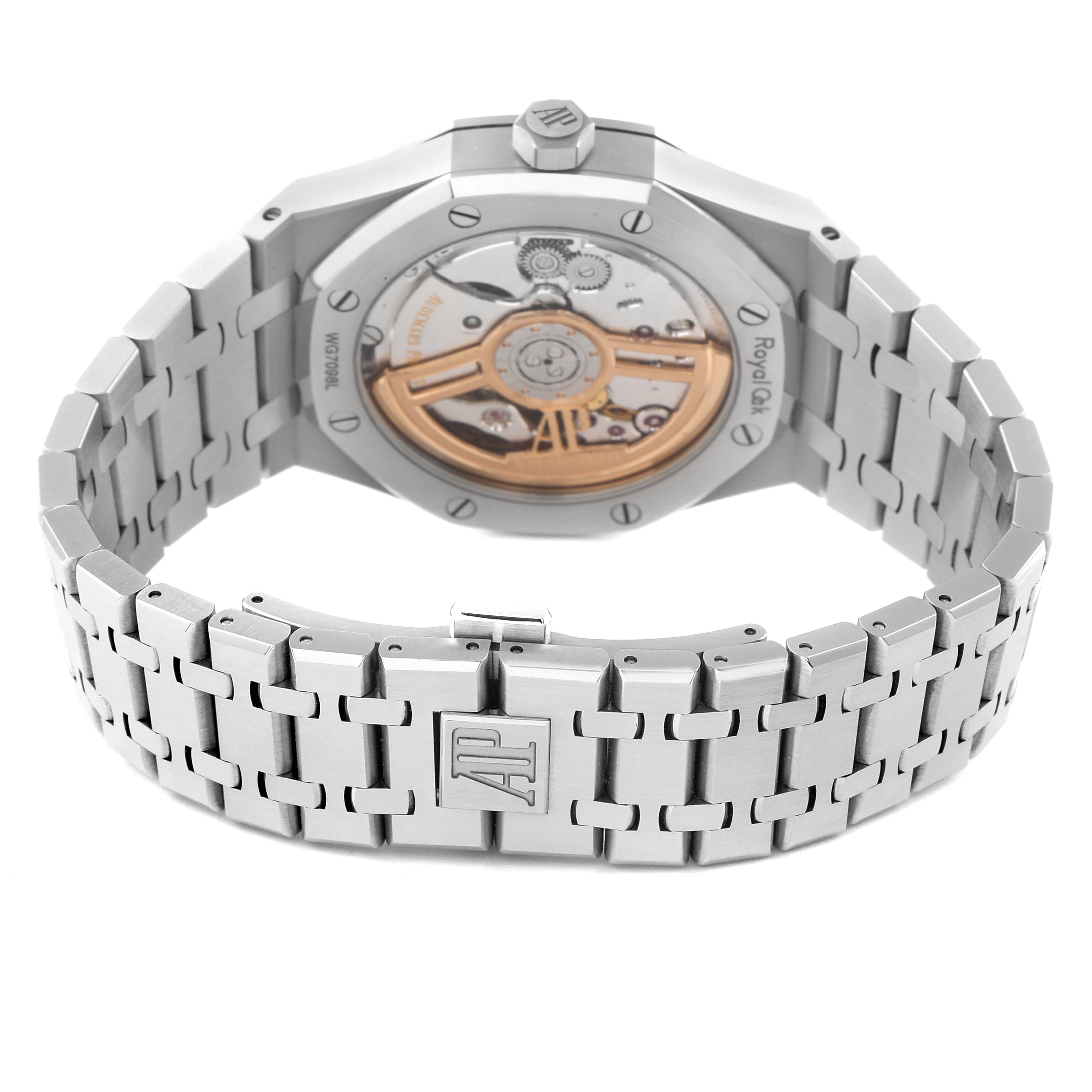 The image shows the back view of a Royal Oak watch by Audemars Piguet, highlighting its stainless steel bracelet and exposed movement.