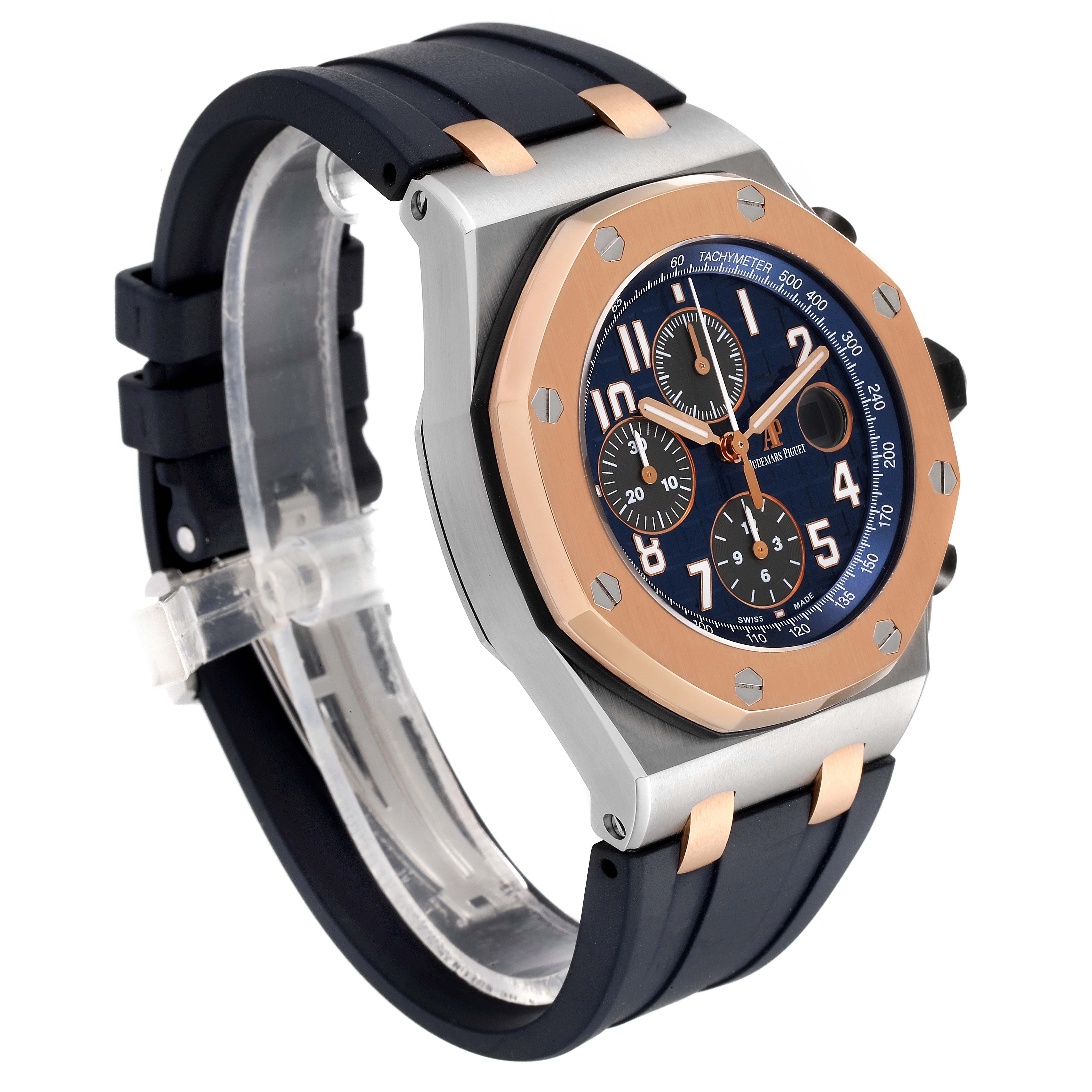 This image shows an angled view of the Audemars Piguet Royal Oak Offshore 26471SR.OO.D101CR.01 Men's Steel and Gold (two tone) Blue Dial 26471SR.OO.D101CR.01 Men's Steel and Gold (two tone) Blue Dial watch, highlighting its bezel, crown, and strap.