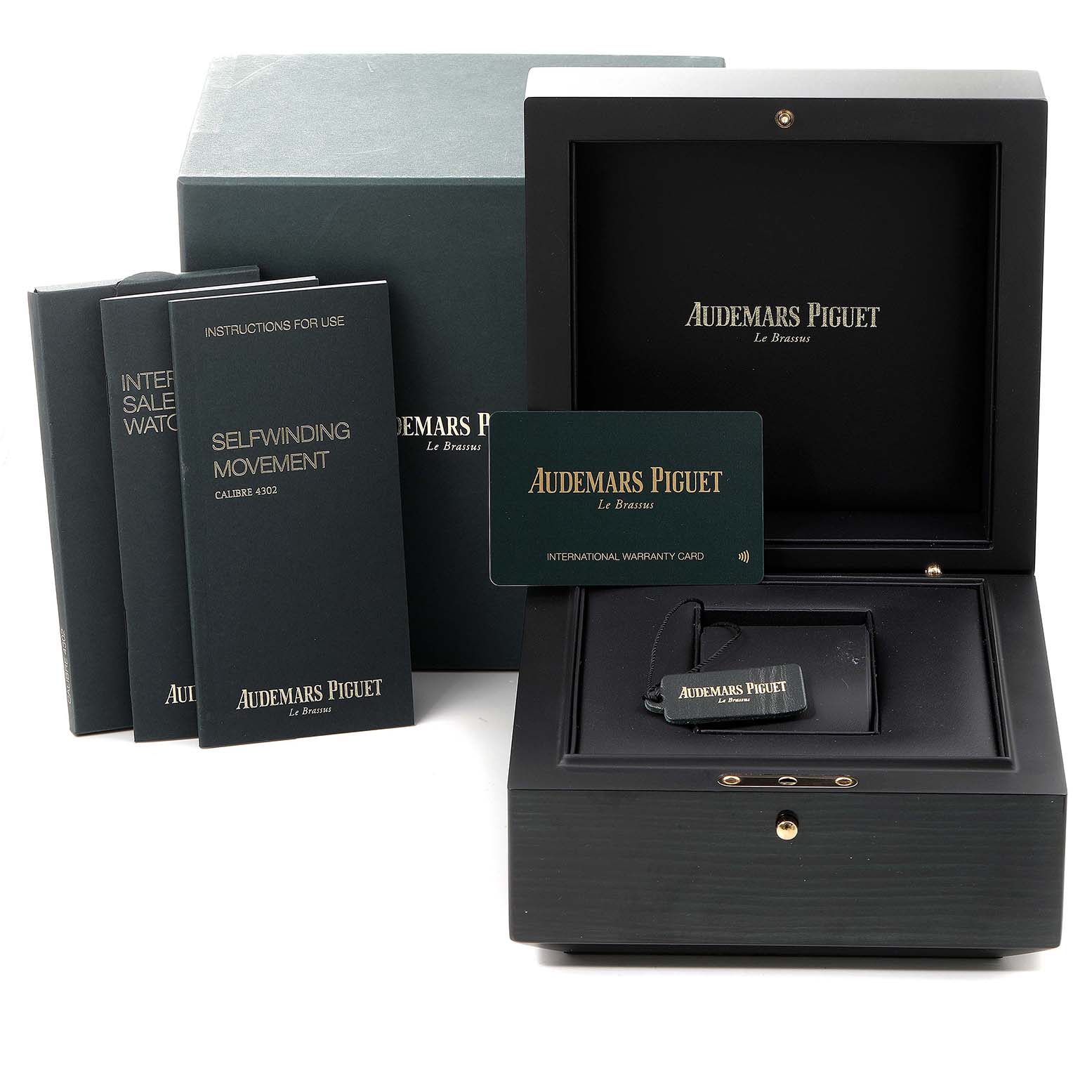 The image shows the packaging, warranty card, and booklets for an Audemars Piguet Royal Oak 15500ST.OO.1220ST.04 Men's Stainless Steel Silver Dial 15500ST.OO.1220ST.04 Men's Stainless Steel Silver Dial watch.