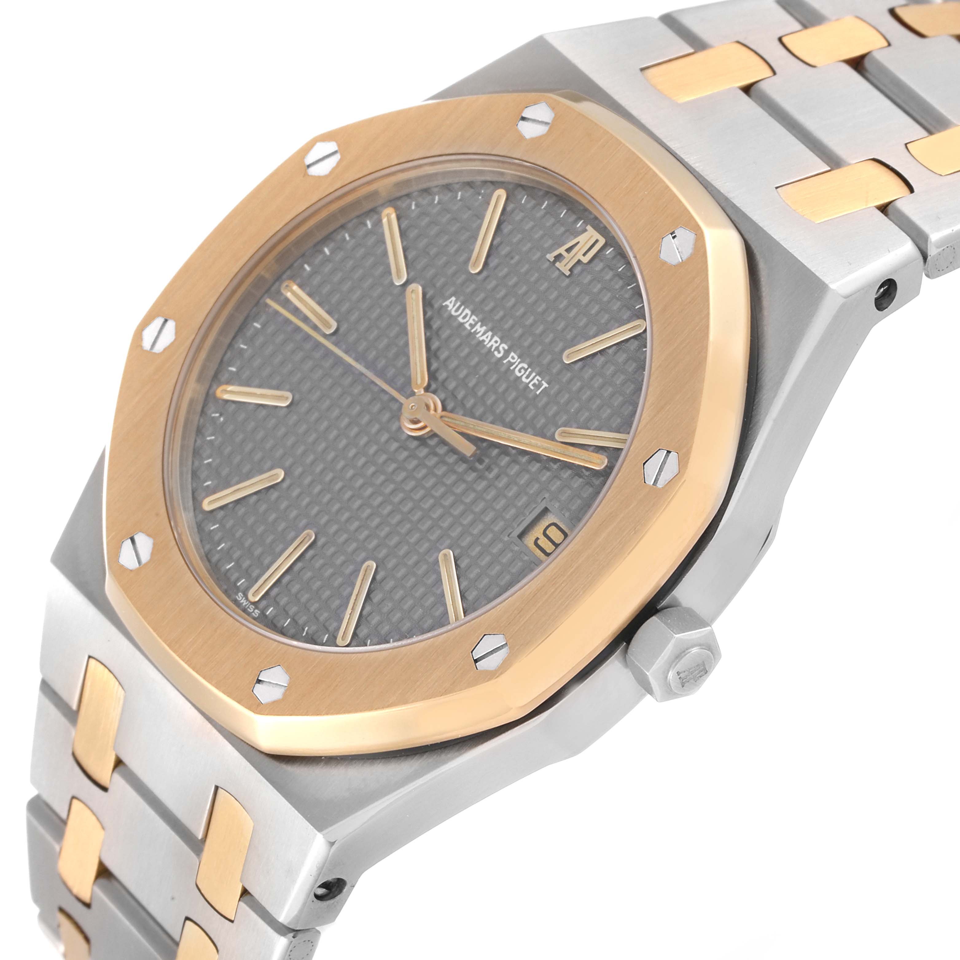 The image shows a close-up angled view of the Audemars Piguet Royal Oak 6023SA Men's Steel and Gold (two tone) Grey Dial 6023SA Men's Steel and Gold (two tone) Grey Dial watch, highlighting the bezel, dial, and part of the bracelet.