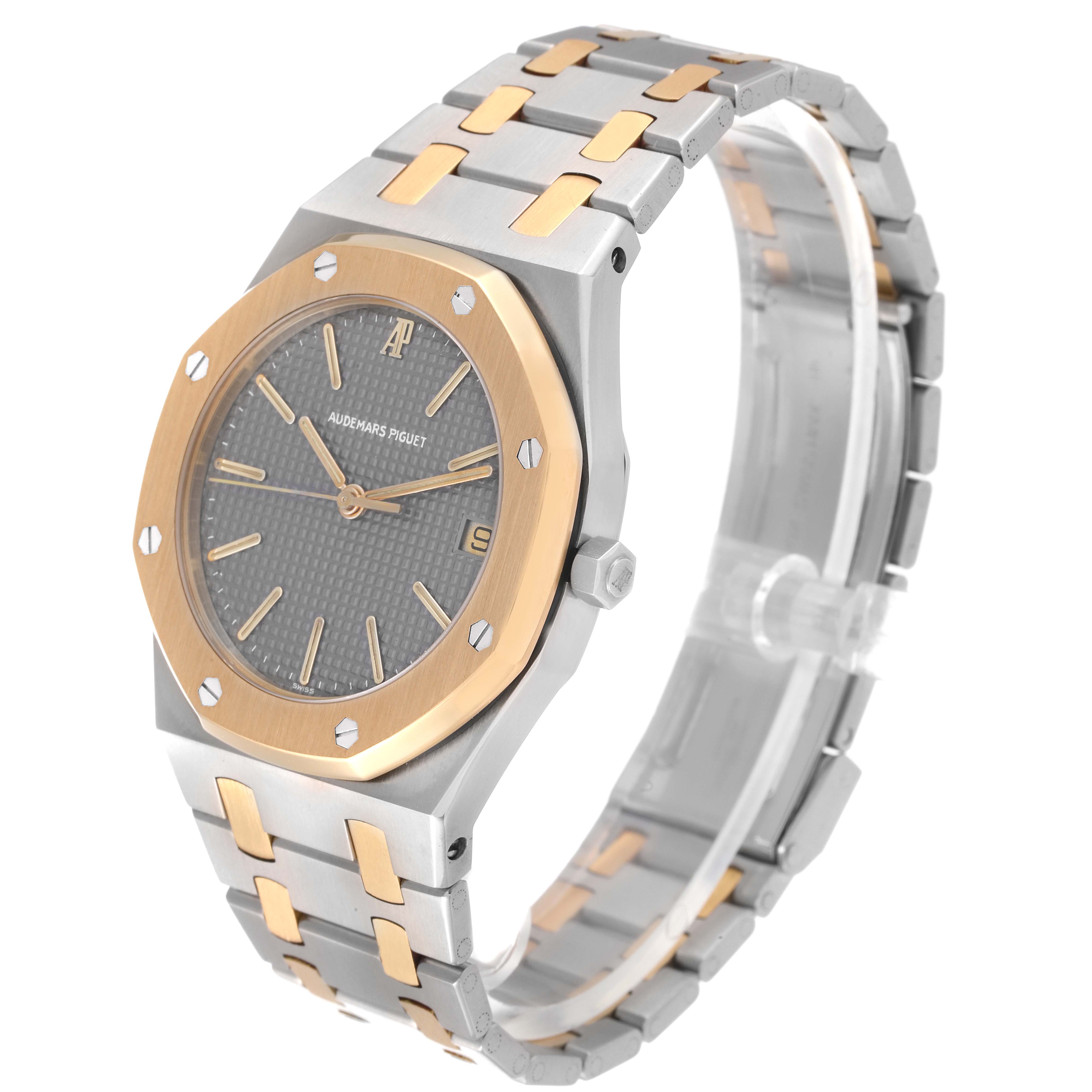 The image shows a side angle view of an Audemars Piguet Royal Oak 6023SA Men's Steel and Gold (two tone) Grey Dial 6023SA Men's Steel and Gold (two tone) Grey Dial watch with a two-tone bracelet and octagonal bezel.