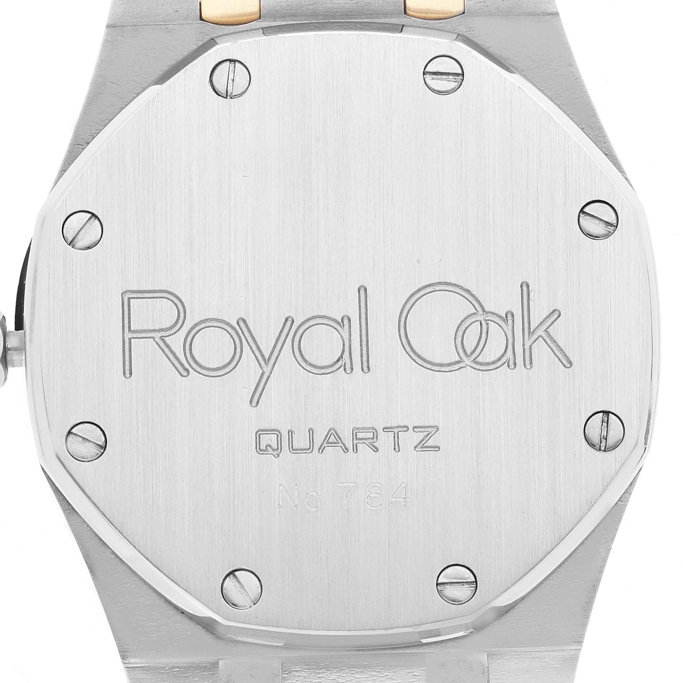 This image shows the case back of an Audemars Piguet Royal Oak 6023SA Men's Steel and Gold (two tone) Grey Dial 6023SA Men's Steel and Gold (two tone) Grey Dial watch, including the model name and serial number.