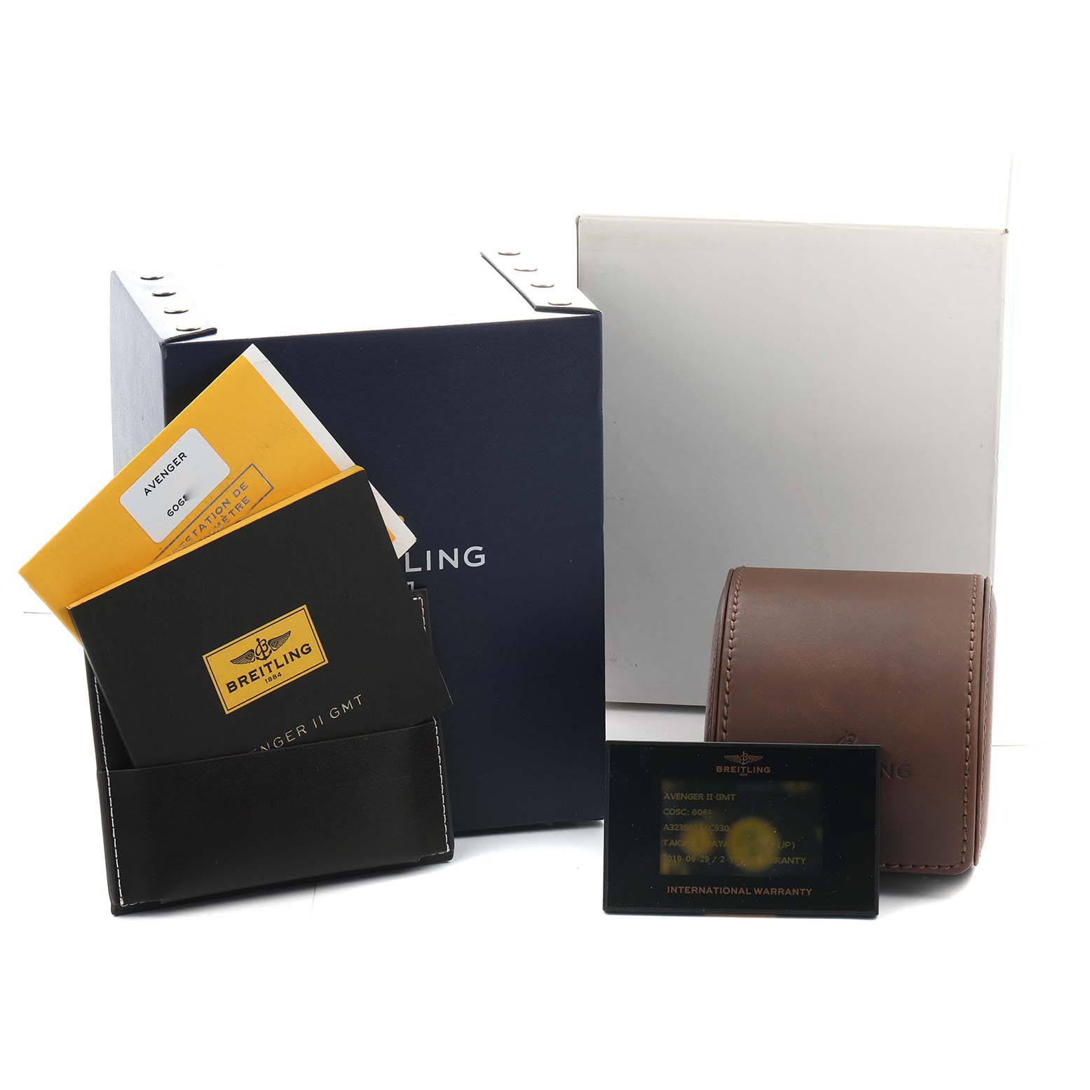 The image shows Breitling Avenger A32390 Men's Stainless Steel Mother of Pearl Dial packaging, manuals, warranty card, and a leather case, photographed from the front.