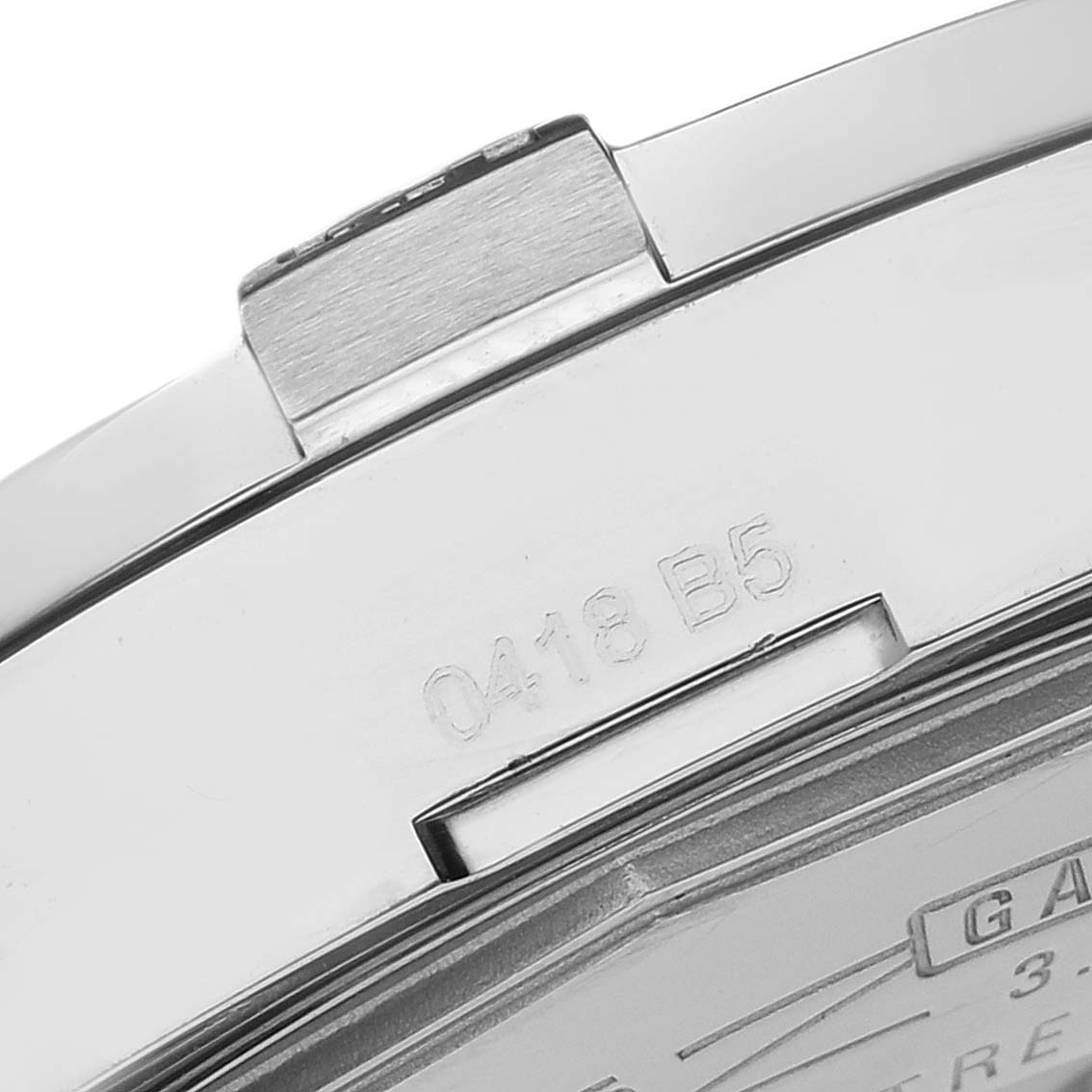 The image shows a close-up of the clasp and serial number on a Breitling Avenger A32390 Men's Stainless Steel Mother of Pearl Dial watch.