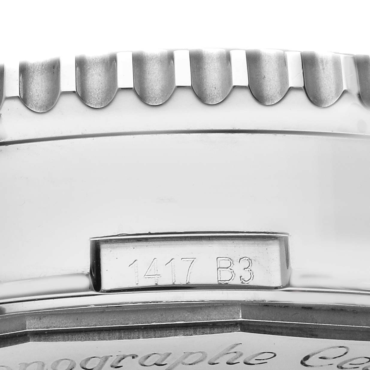 The image shows a close-up of the Breitling Navitimer AB0127 Men's Stainless Steel Blue Dial AB0127 Men's Stainless Steel Blue Dial's side, focusing on the engraved bezel and part of the case side.