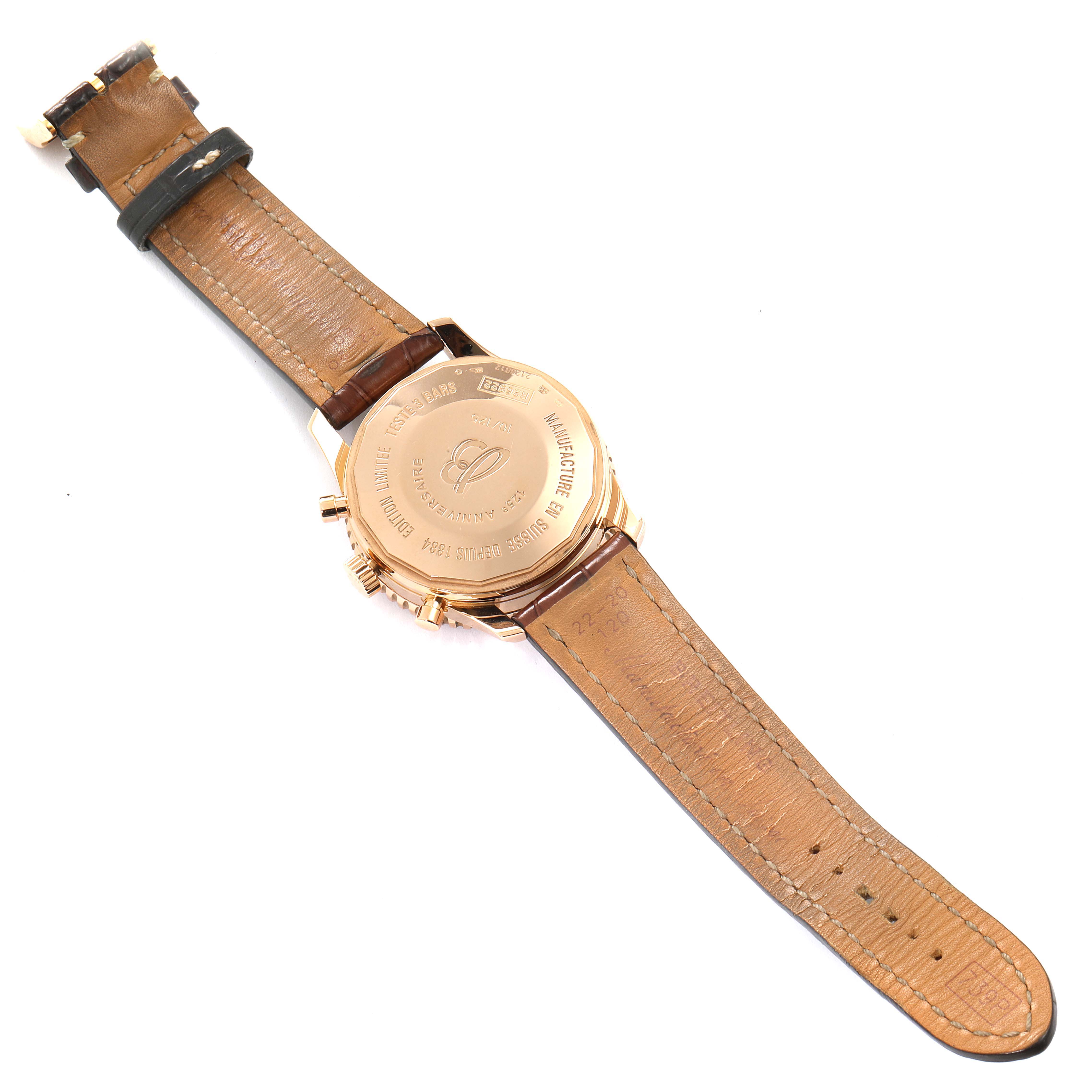 The image shows the back view of a Breitling Navitimer R26322 Men's Rose Gold Silver Dial R26322 Men's Rose Gold Silver Dial watch, highlighting its case back and leather strap.