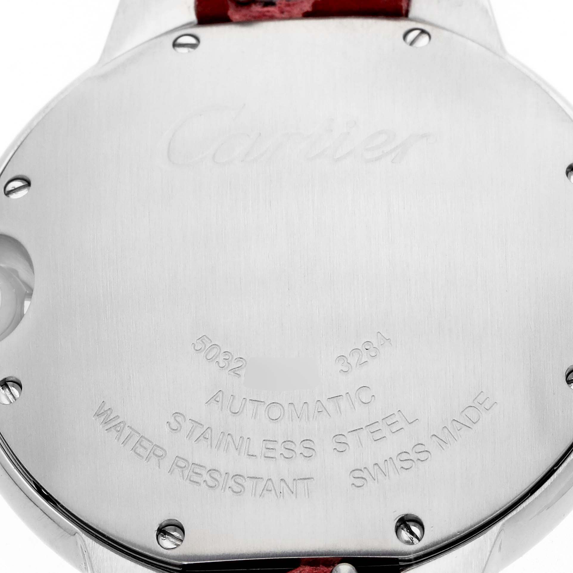 The image shows the back of a Cartier Ballon Bleu WSBB0007 Women
s Stainless Steel Pink Dial watch, displaying its stainless steel case, engravings, and screws.