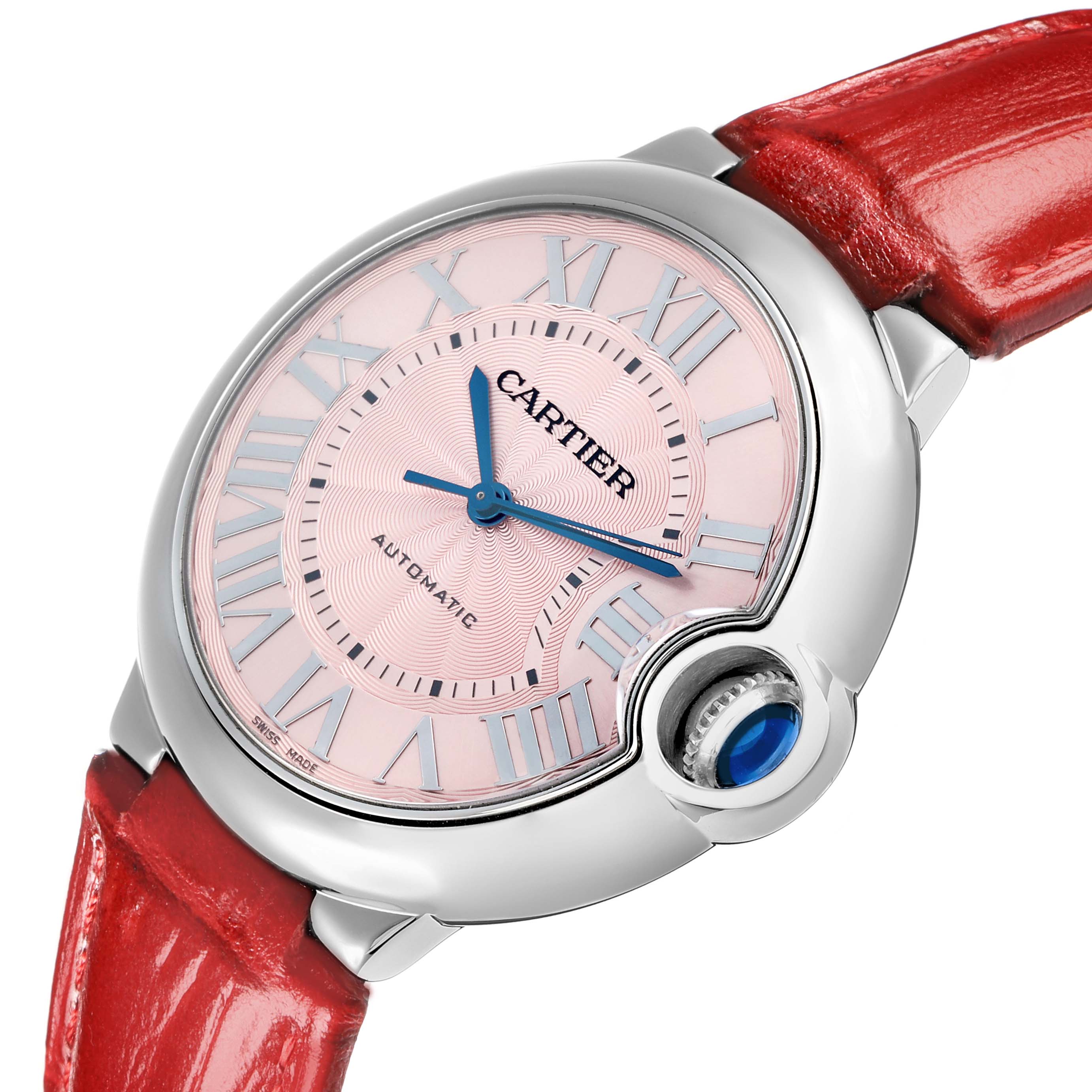 The Cartier Ballon Bleu WSBB0007 Women
s Stainless Steel Pink Dial watch is shown at an angled view, highlighting the dial, blue hands, Roman numerals, crown, and red strap.