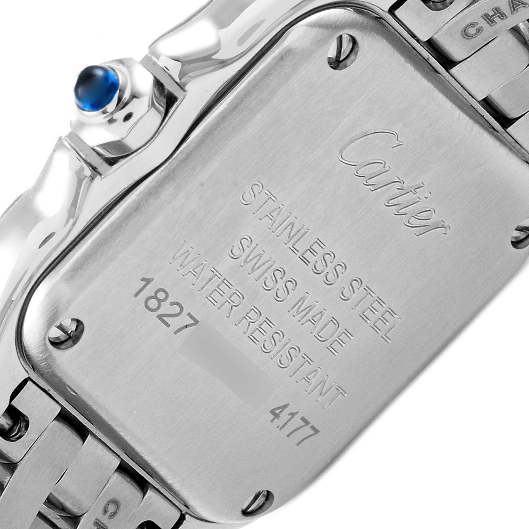 The image shows the back of a Cartier Panthère watch, highlighting its stainless steel case, branding, and serial number.
