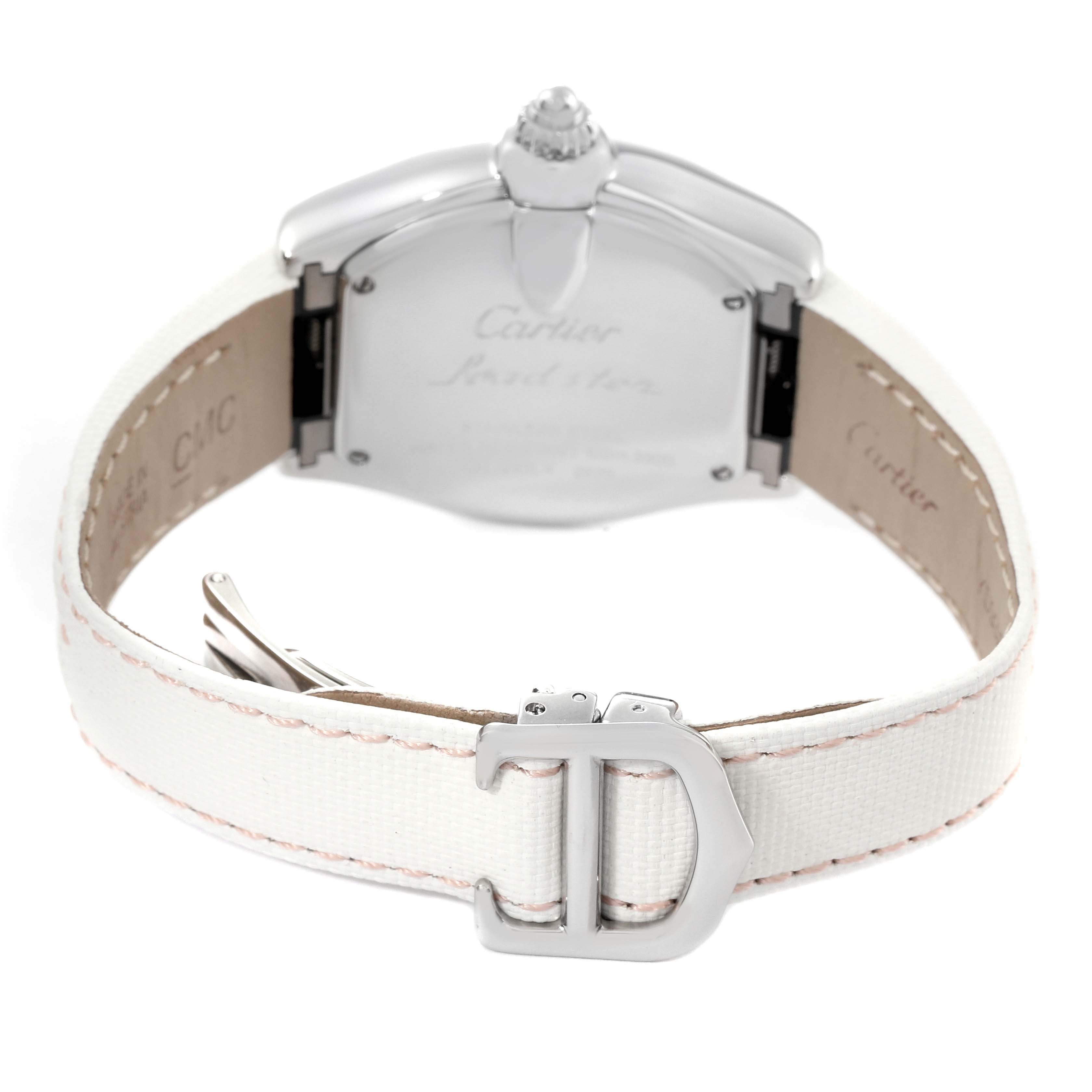 The Cartier Roadster W62054V3 Women's Stainless Steel Pink Dial W62054V3 Women's Stainless Steel Pink Dial watch is shown from the back, highlighting its case back, crown, and white leather strap with a buckle.
